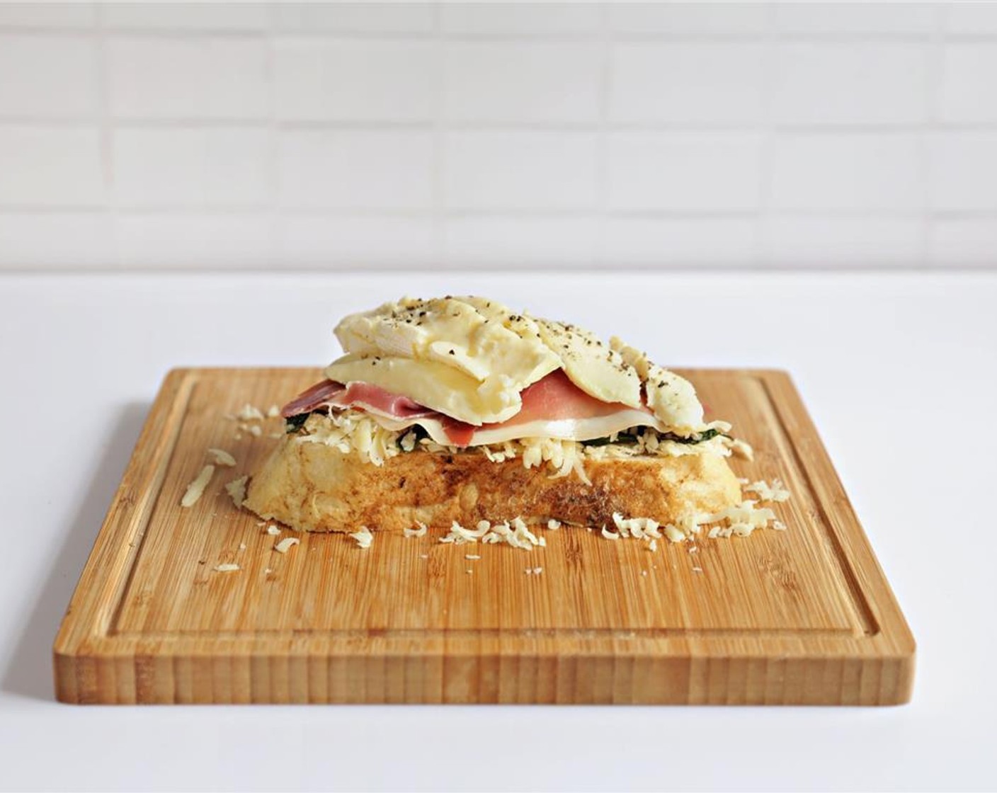 step 9 Add sliced Brie Cheese (1.5 oz) and sprinkle with Ground Black Pepper (to taste).