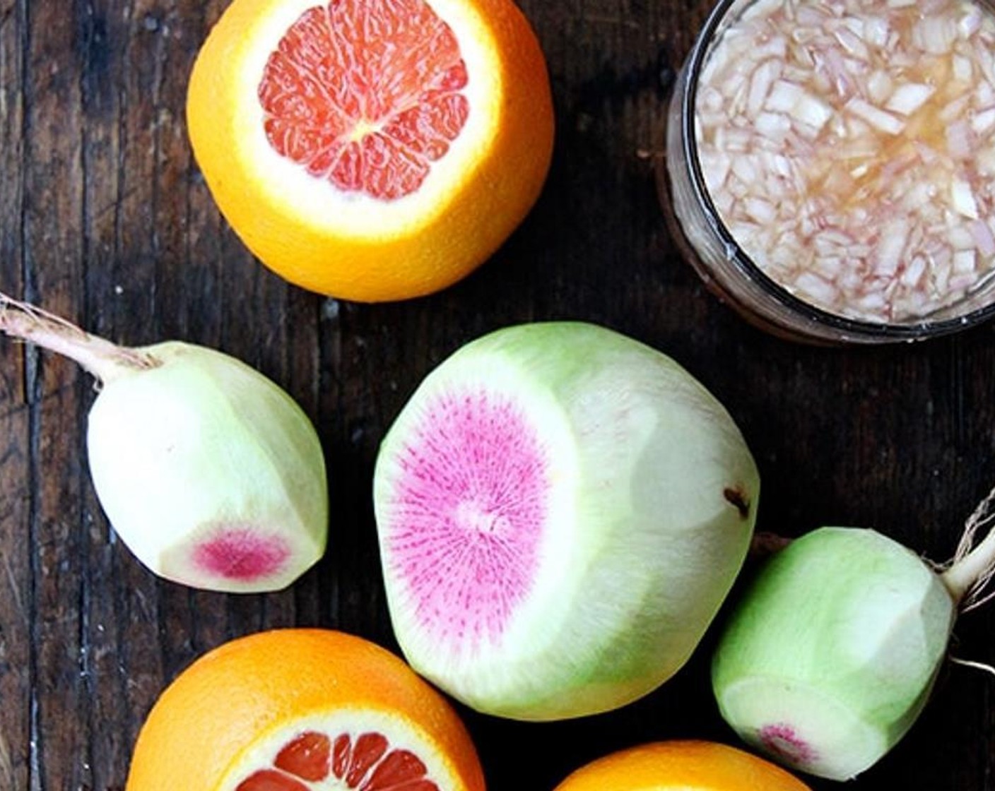 step 4 Cut off each end of each Oranges (2). Squeeze each end over the radishes, then discard. Use a sharp knife to remove the skin from the orange. Cut in between membranes to remove each slice. Squeeze remaining membrane all over the radishes to extract any juice.