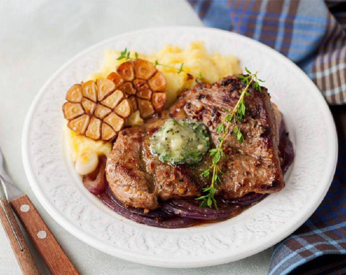 Marinated Pork Chops with Herb Butter