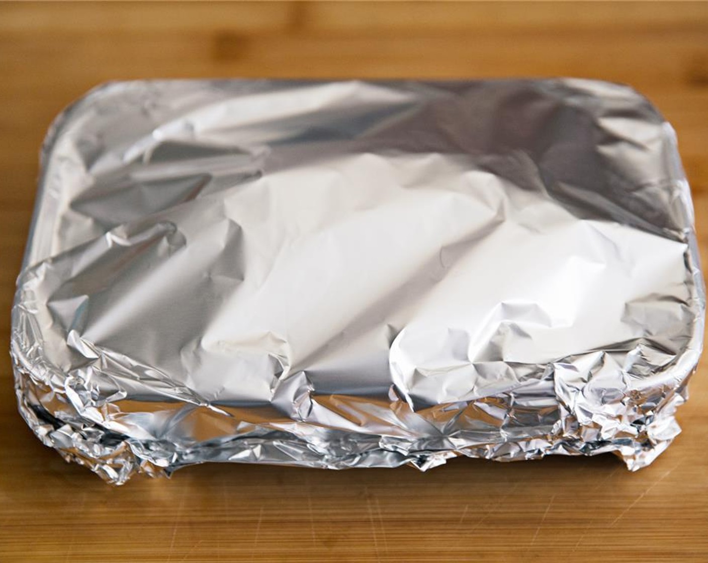 step 7 Tightly cover with a piece of aluminum foil and place in the oven for 1 hour and 30 minutes.