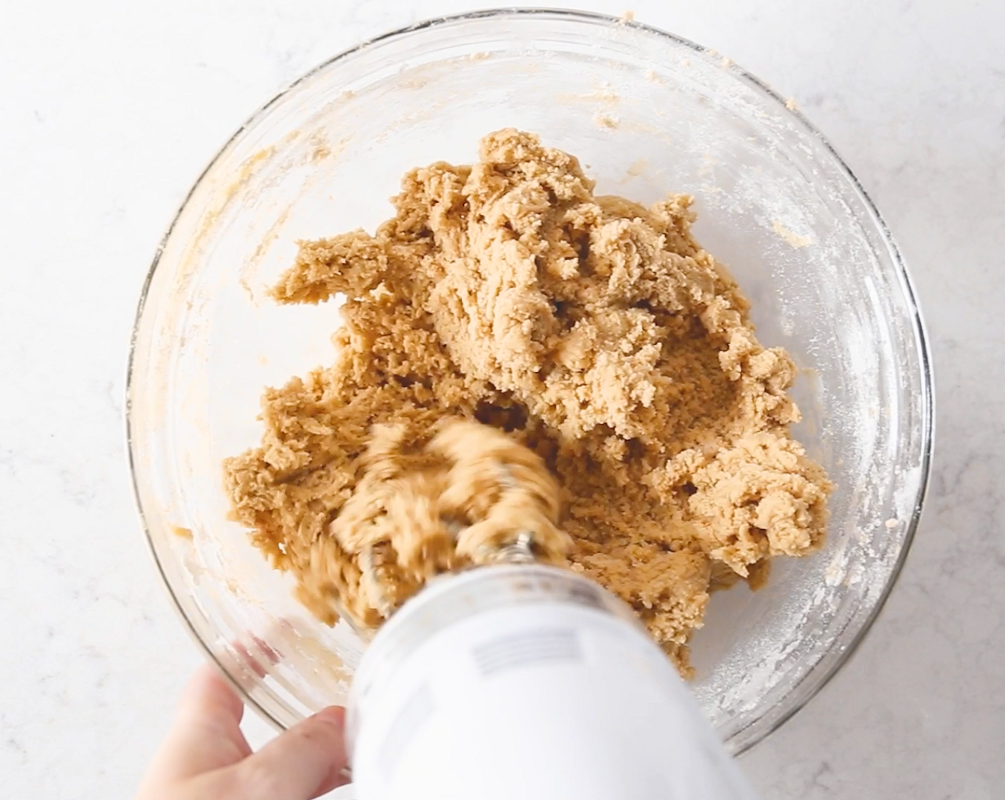 step 4 Empty the flour mixture into the butter mixture and reduce the speed to low, mixing until they are just combined.