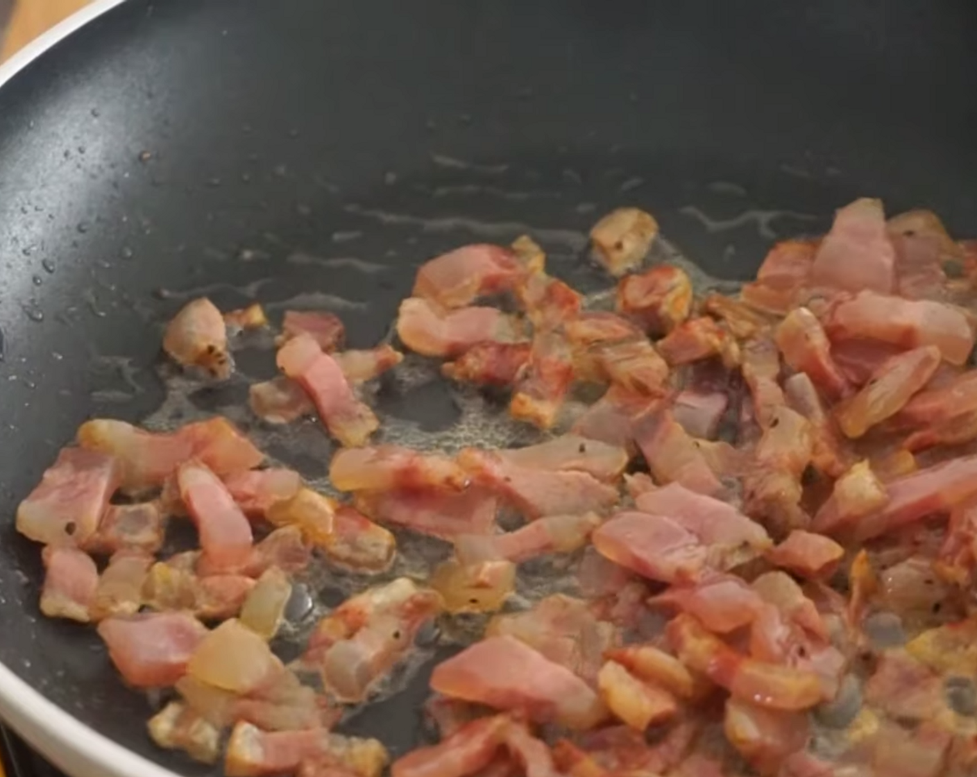 step 6 When the oil has started to warm up, add the Guanciale (7 oz) and leave it to simmer and brown – this will be the perfect texture for your spaghetti frittata di carbonara! This should cook in 5-7 minutes.