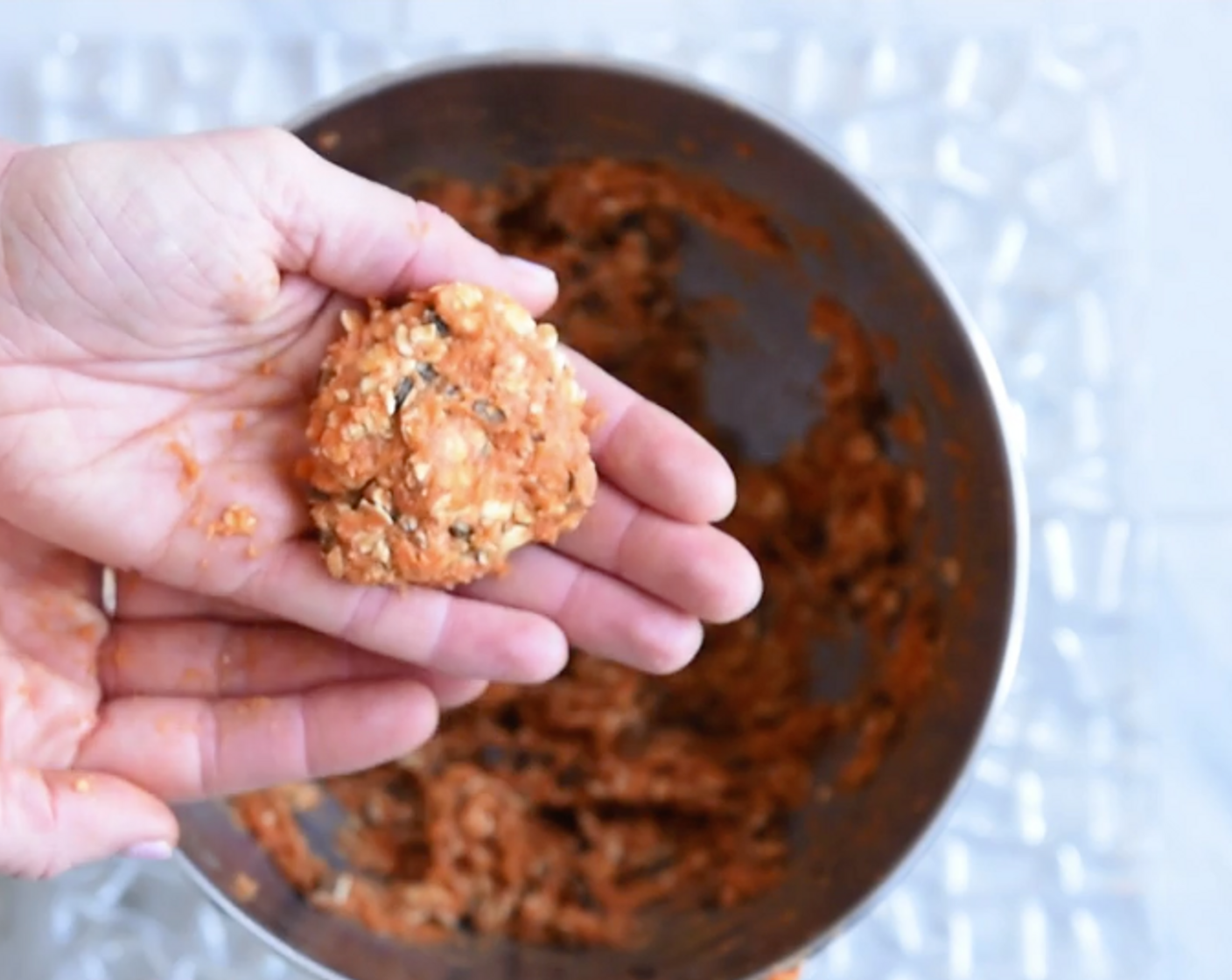 step 4 Using your hands, form burger mixture into balls about the size of a golf ball. Press to flatten into patties and place patties on wax paper until ready to fry.