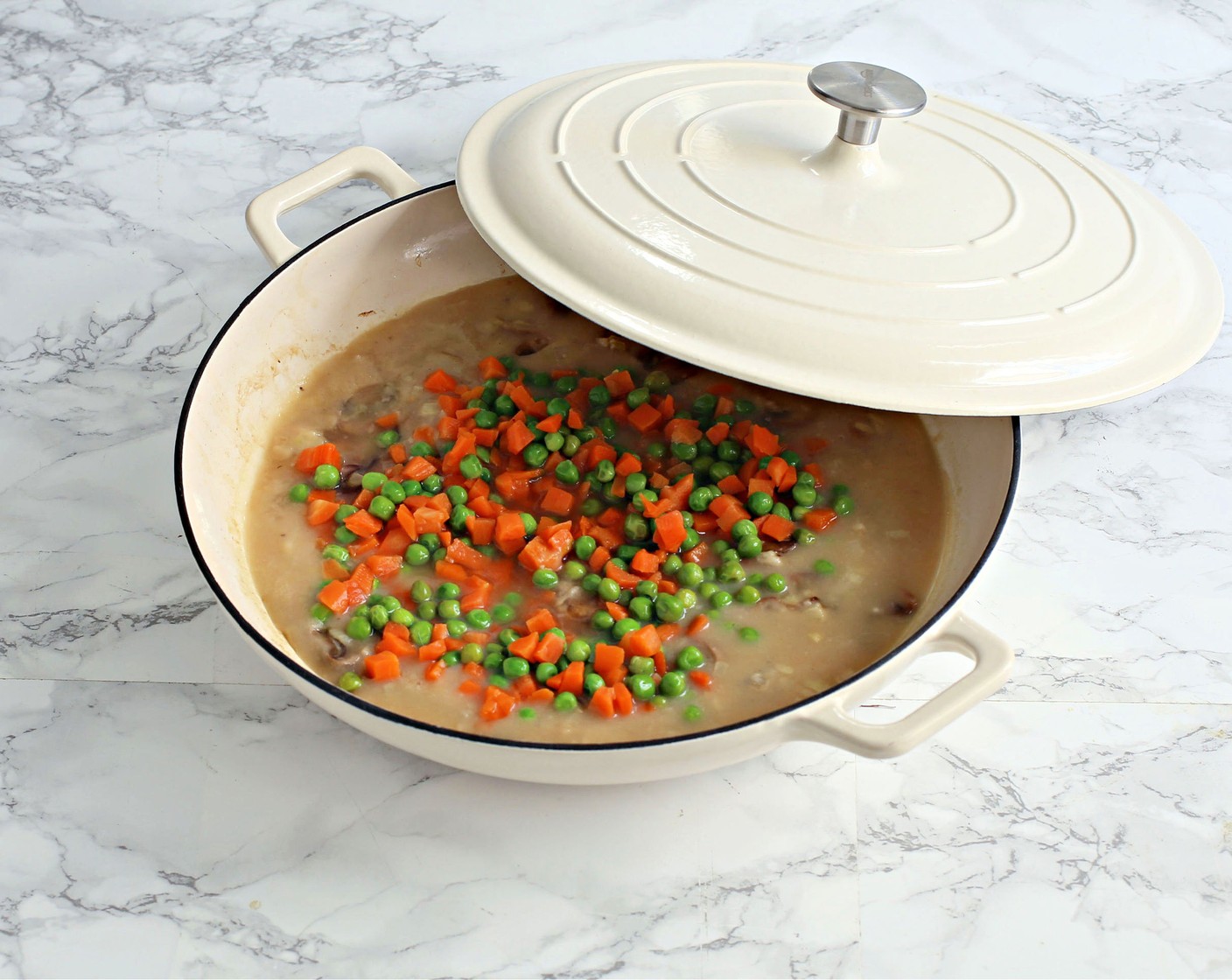 step 5 Add the Cannellini White Kidney Beans (2 cans) and the Frozen Peas and Carrots (1 pckg).