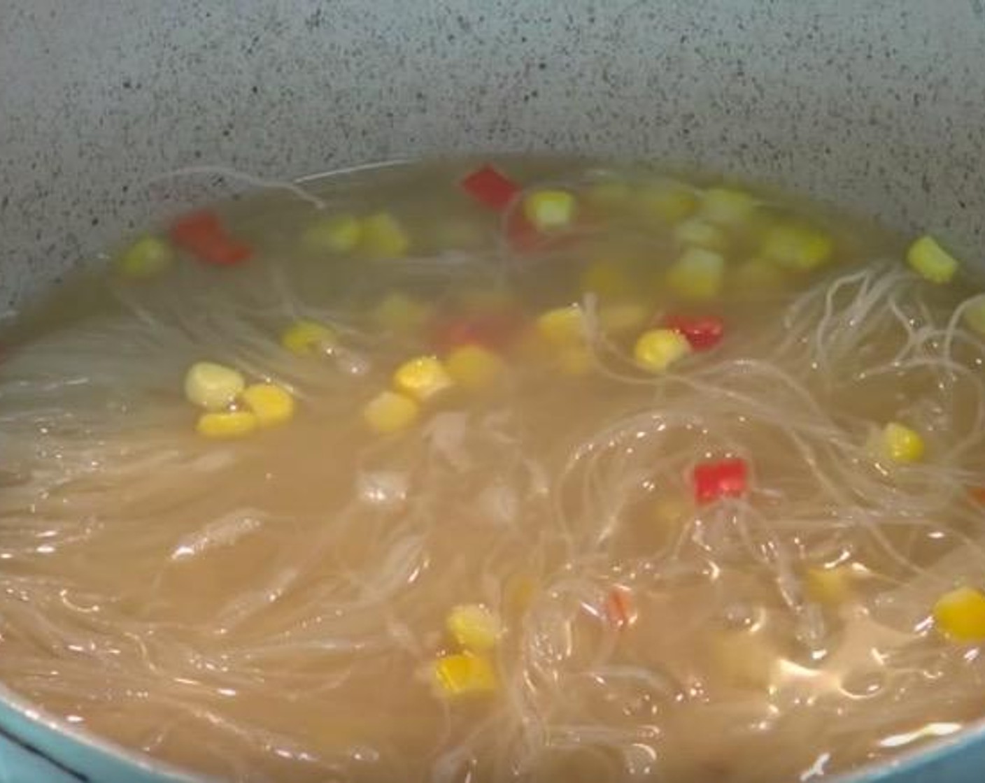 step 1 Add Chicken Stock (4 cups), Water (1 cup), Fresh Ginger (1 tsp), Garlic (1 clove), and Red Chili Pepper (1), into a big pot and turn it to medium heat. Next add some Corn Kernels (2 1/4 cups), Rice Noodles (9 oz). Cook it for 1 minute or until it boils. Then add Chicken Breasts (2), Scallion (1 bunch) and mix everything up. Cook for another 2 minutes.