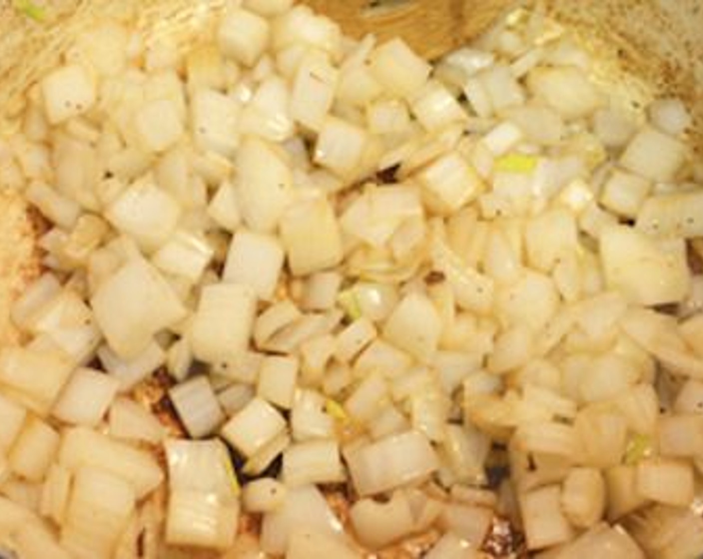 step 5 Add the diced onions to the same pot and sauté them for a couple minutes until they turn soft and translucent.