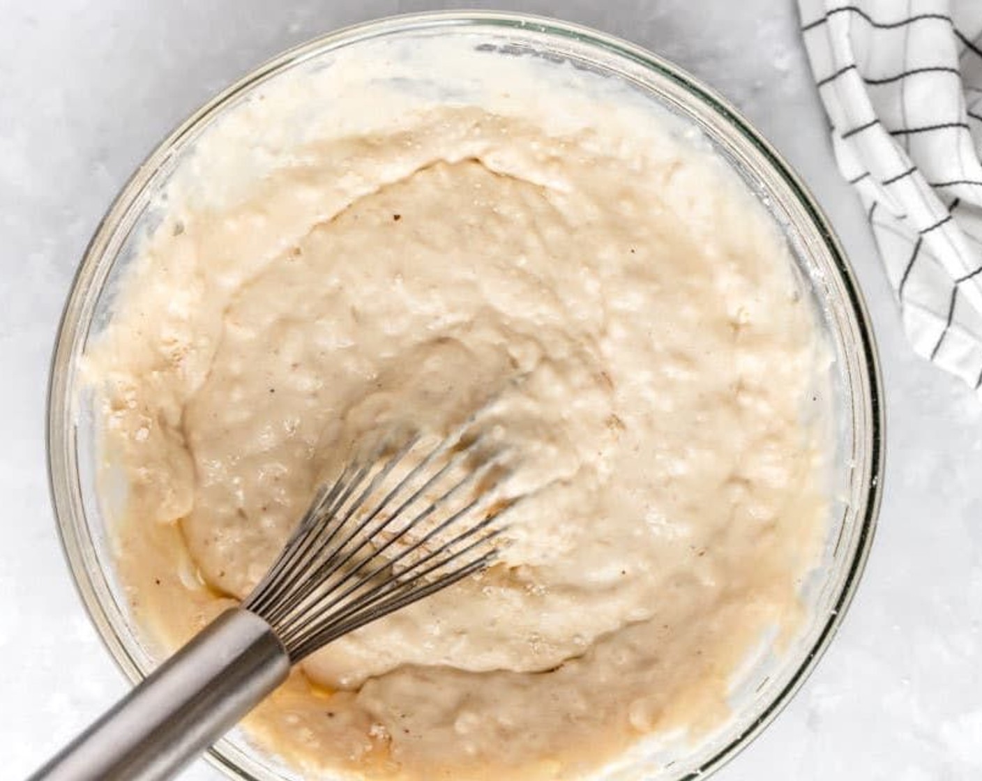 step 3 Add the Eggs (2), Buttermilk (2 cups), and Vanilla Extract (1 tsp) and whisk until just combined. Some small lumps remaining are fine. Do not over stir the mix - overmixing makes for a flat pancake. Mix until a few streaks of flour are remaining. Let batter sit for about 10 minutes.