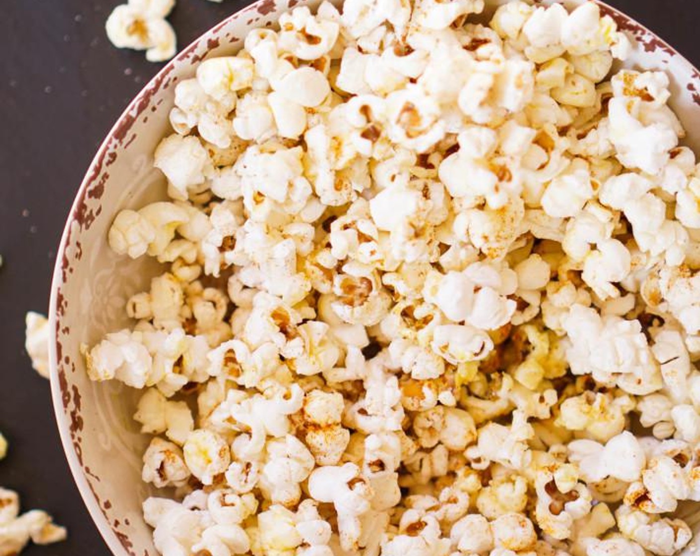 step 3 Transfer half of the popcorn to a bowl, season with Old Bay® Seasoning (to taste) and Garlic Salt (to taste) as desired, then repeat with the remaining popcorn. Sprinkle the bowl evenly with Parmesan Cheese (1 Tbsp) as desired.