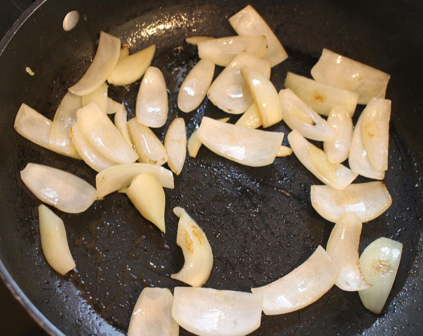 step 7 Saute Onion (1) in Peanut Oil (1 Tbsp) until translucent.