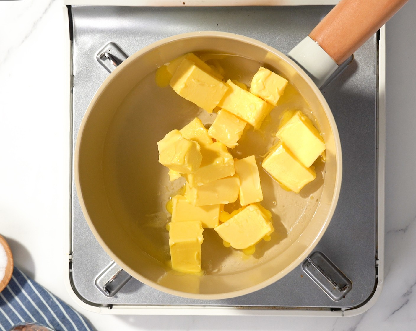 step 3 Add Butter (1 cup) and Water (1 cup) to a saucepan and bring to a boil. Remove from heat.