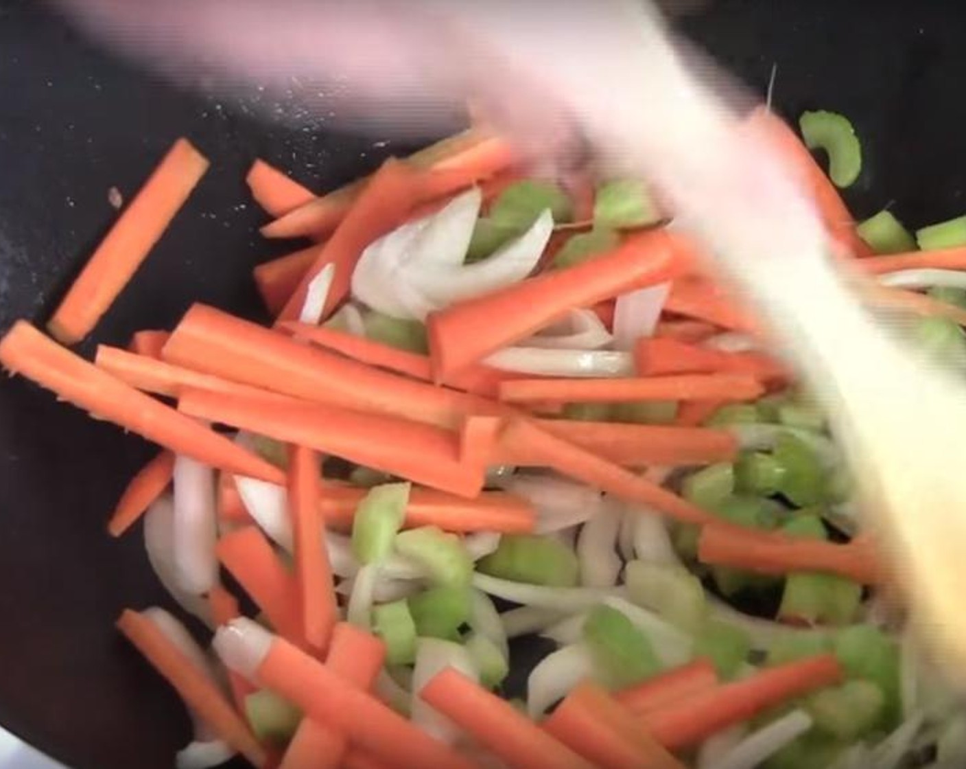 step 3 Transfer the meat to a bowl, and cook the veggies. Put Yellow Onion (1), Celery (2 stalks) and Carrots (2) to the pan. Stir fry for one or two minutes.