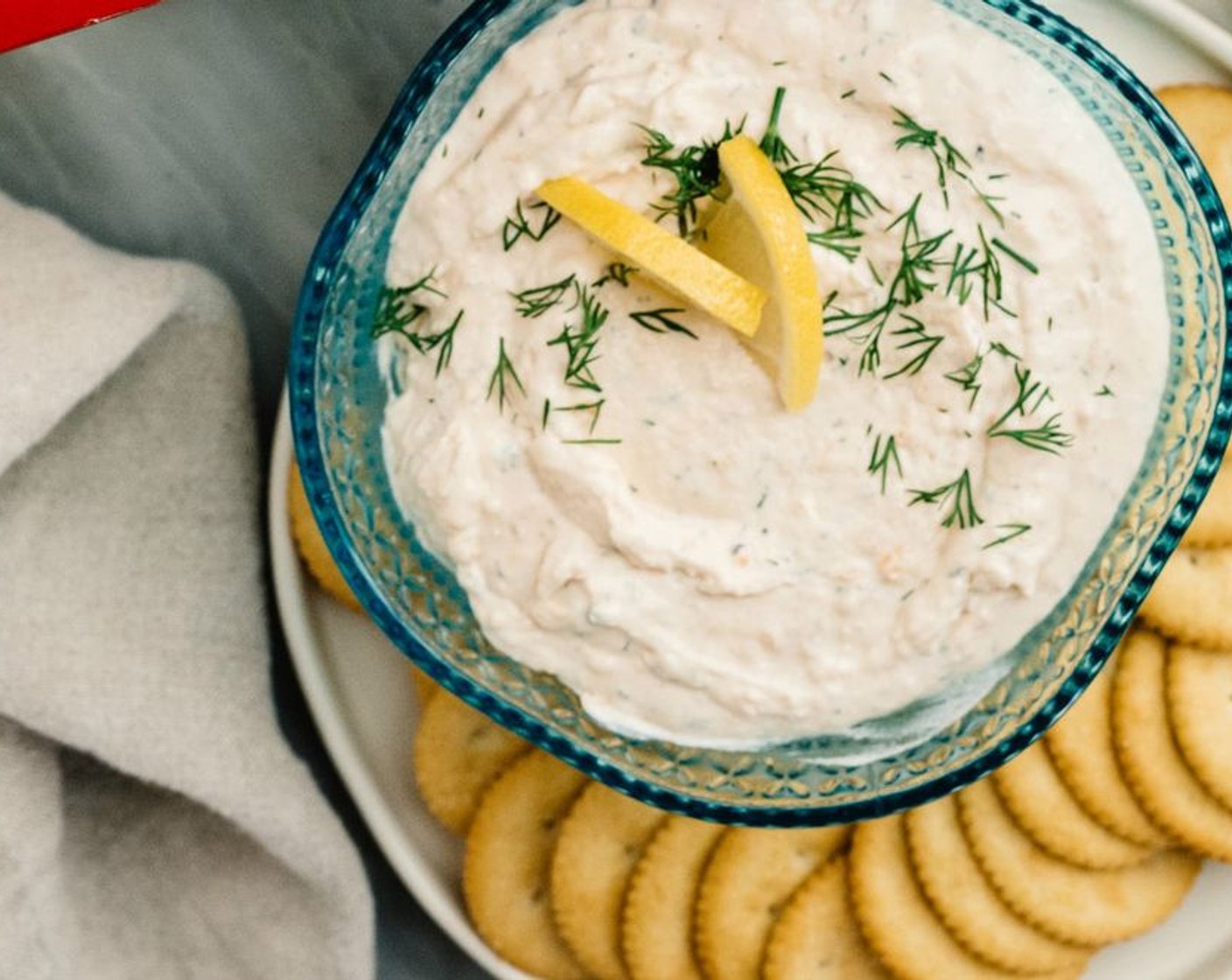 step 4 Transfer the dip into a serving bowl, garnish with lemon slices and more dill, if desired. This dip is good served at room temperature or chilled. And don't forget the Ritz® Crackers (to taste)!