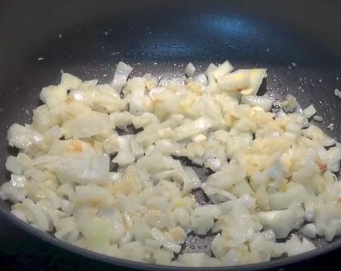 step 1 In a frying pan, add Olive Oil (2 Tbsp), Garlic (2 cloves) and Yellow Onion (1). Cook over medium heat until onions have softened.