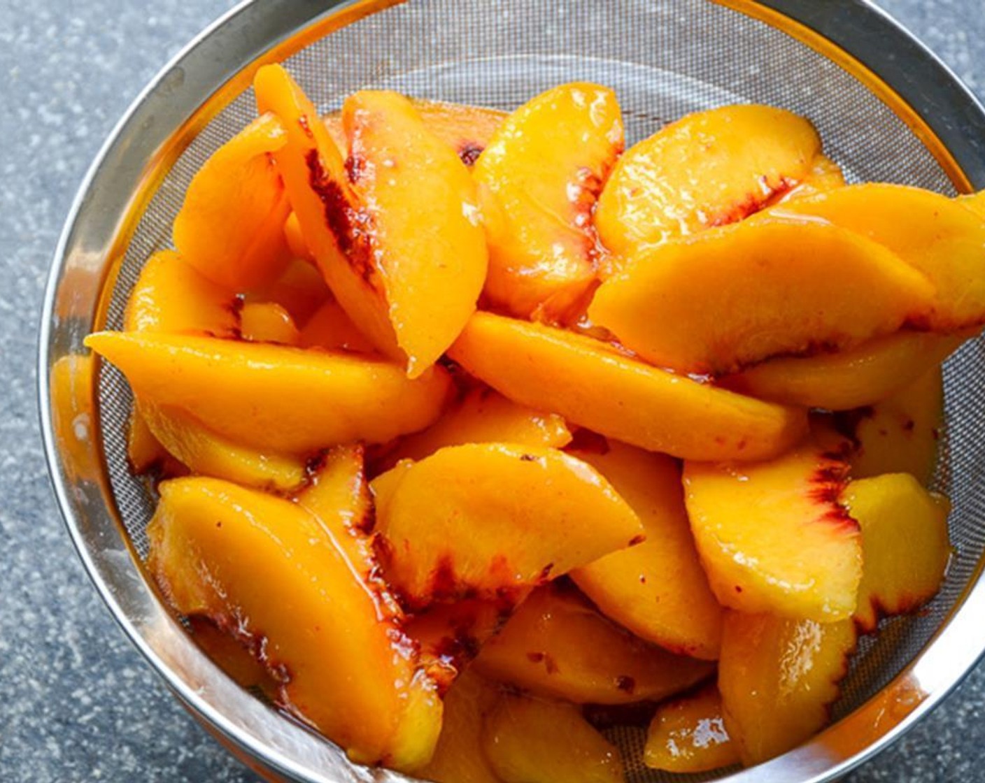 step 6 Place a strainer over a medium bowl. Transfer the peaches to the strainer to drain the juices. Reserve 1/4 cup of the juices for the pie. Transfer peaches back to the original bowl.