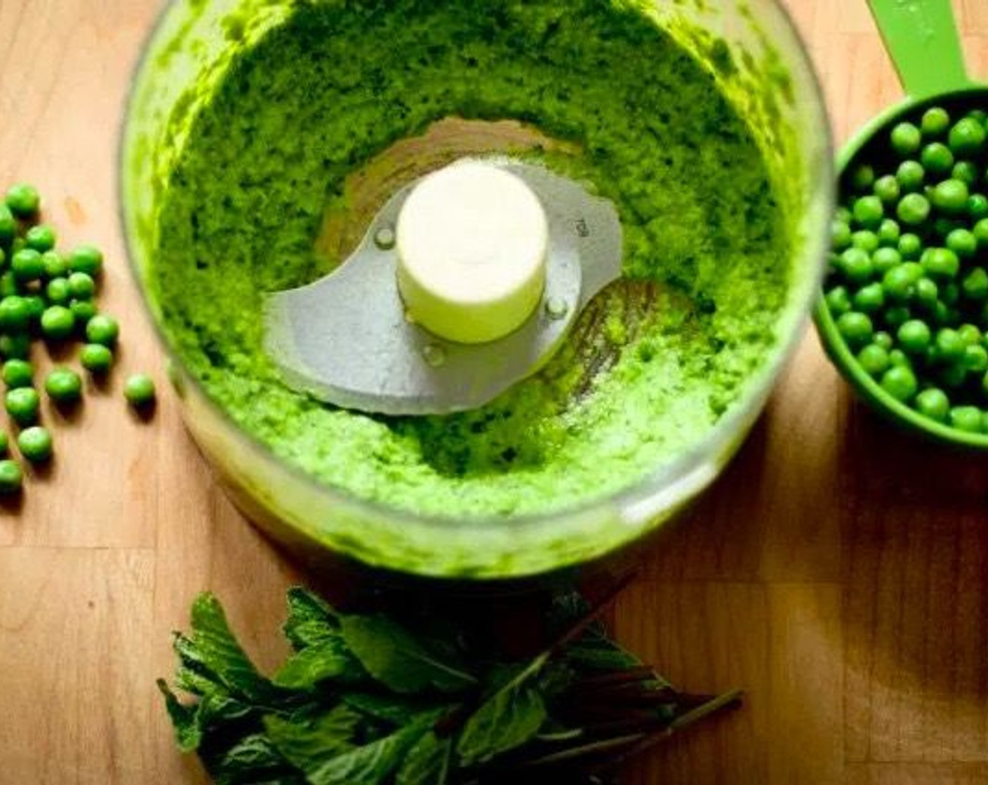 step 10 While risotto is cooking, make pea puree. Place 1 cup of the blanched peas, Fresh Mint (4 Tbsp), Italian Flat-Leaf Parsley (4 Tbsp), a squeeze of Lemon (1), and a generous pinch of salt and pepper in a food processor and blend till smooth, scrapping down sides a couple times. Set aside.
