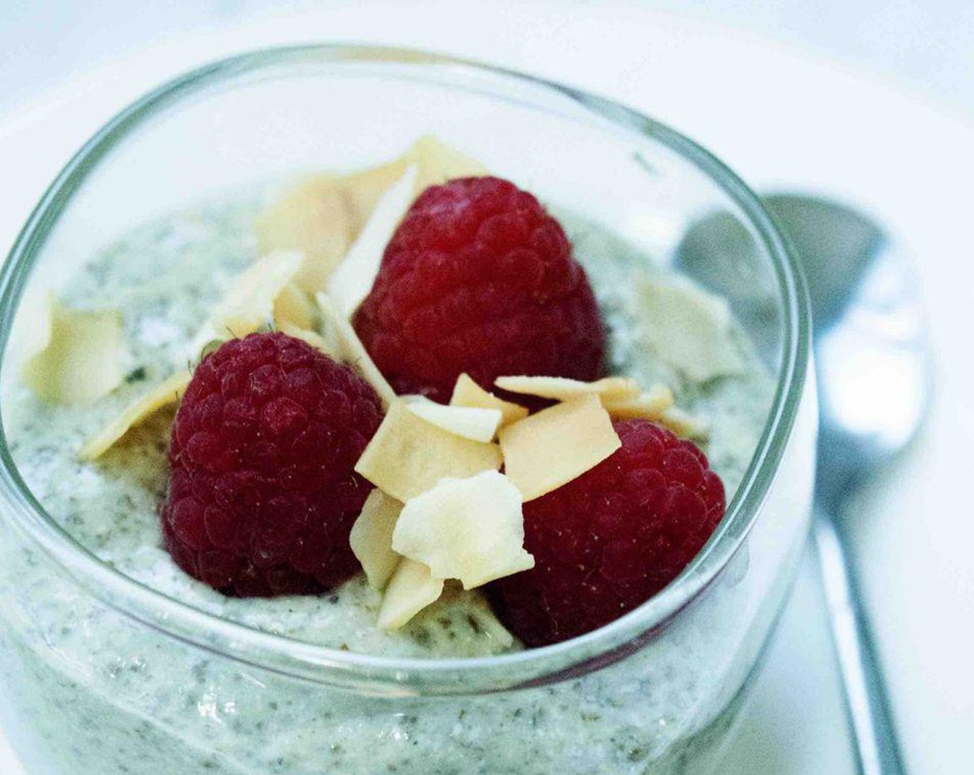 step 3 Portion it into jars or glass containers and top it off with Fresh Raspberries (to taste) and Coconut Chips (to taste).