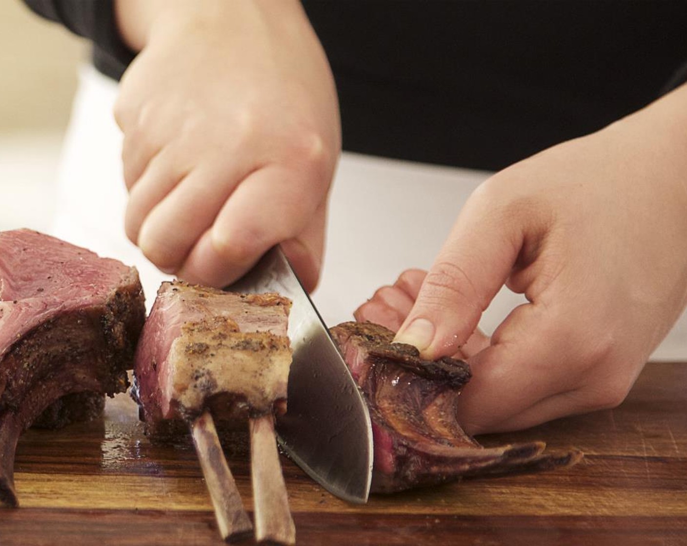 step 15 After the lamb has rested for at least 5 minutes, slice the lamb into 4 equal double chops by guiding your knife alongside the bone and through the "chine" bone.