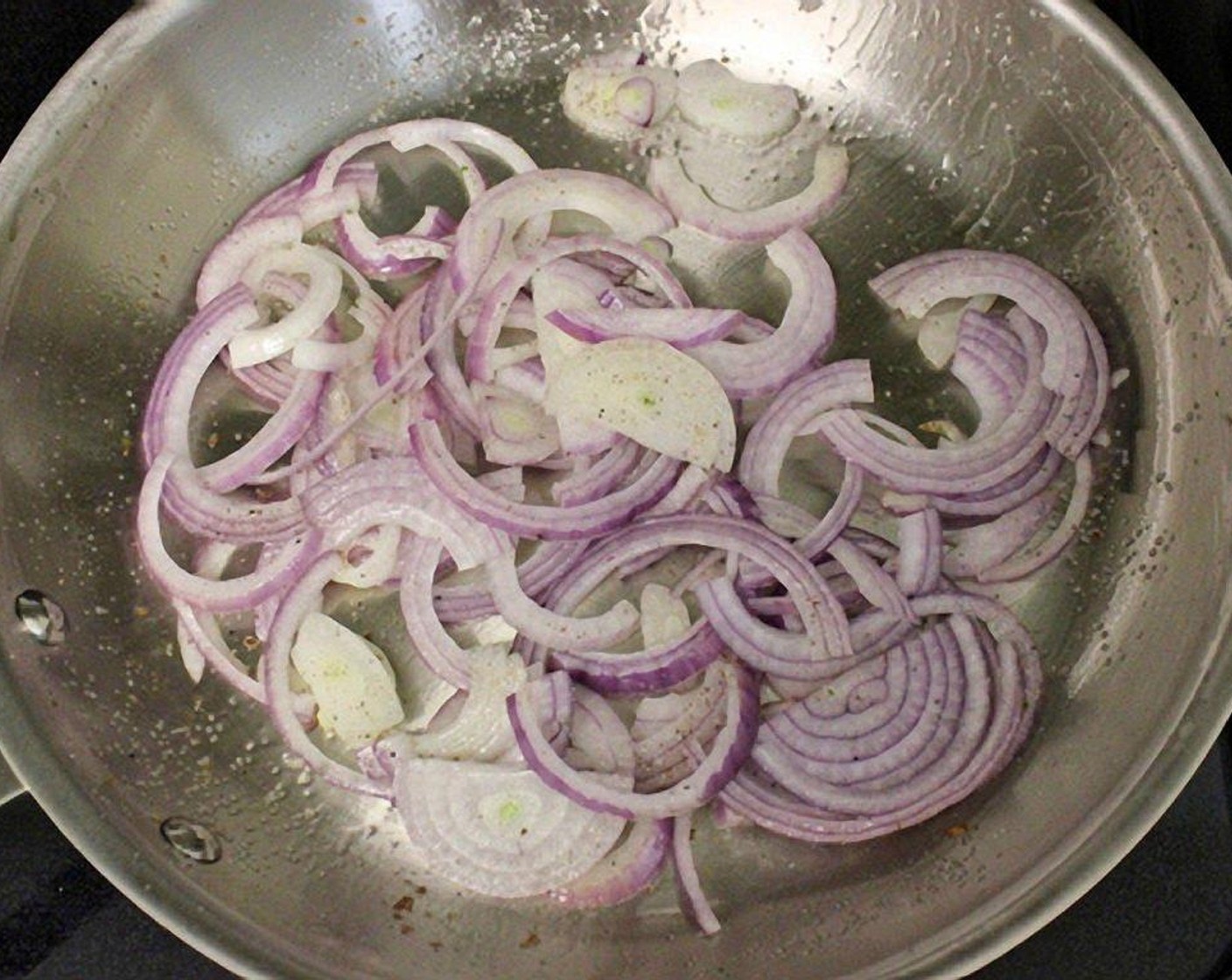 step 10 Heat a large skillet over medium-high heat, adding about a tablespoon of Oil (1 Tbsp) to it. When the oil is hot, add the Red Onion (1), season with salt and ground black pepper and sauté for 2-3 minutes.