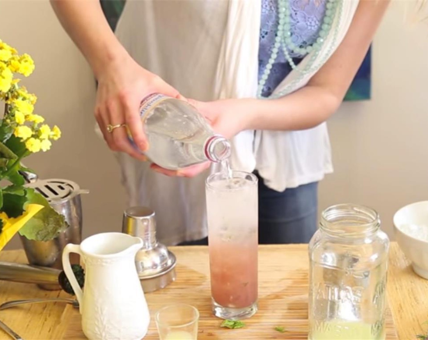 step 3 Fill a glass with Ice (to taste) and strain the contents of the shaker into the glass. Fill the rest of the cup with equal parts Sprite (to taste) and Sparkling Lemon Water (to taste).