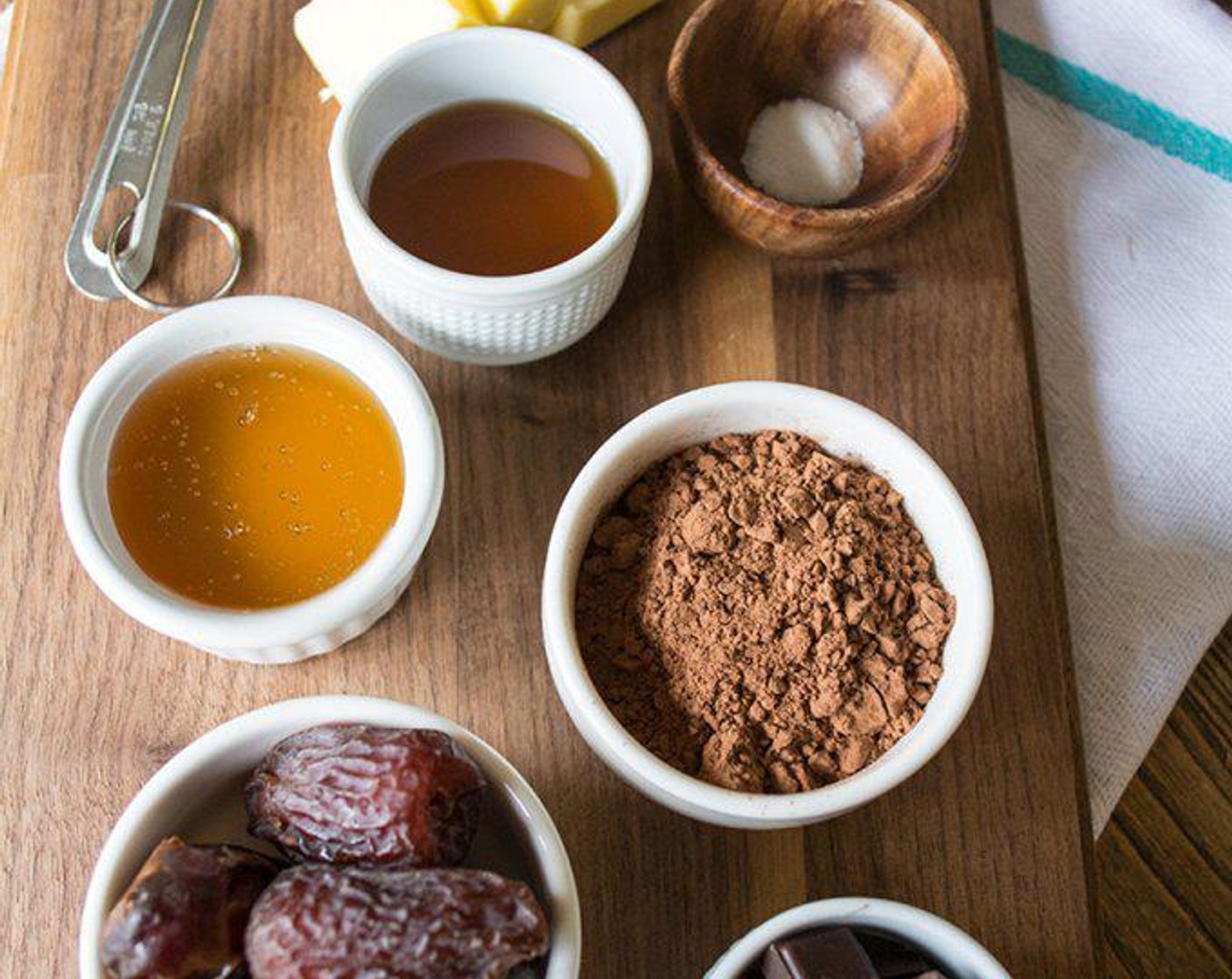 step 1 In a double boiler or heatproof bowl over a simmering saucepan of Organic Butter (3 Tbsp), Extra-Virgin Coconut Oil (1 Tbsp) and 70% Dark Chocolate (4 Tbsp).