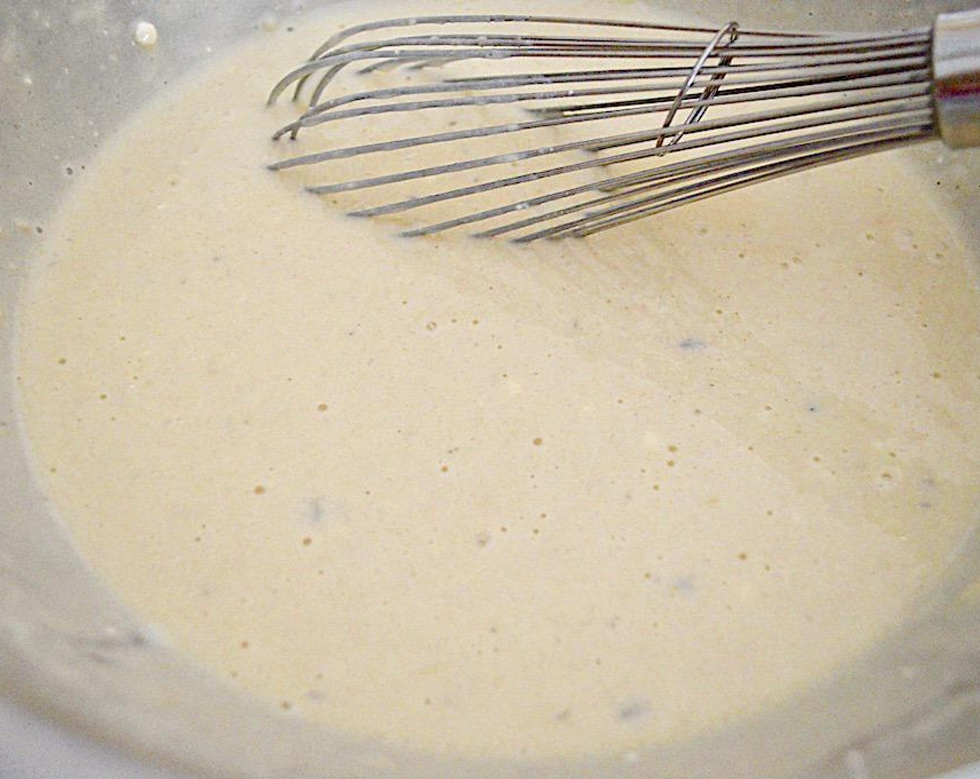 step 4 Pour the wet ingredients into the dry ingredients and whisk everything together until it is a smooth batter.