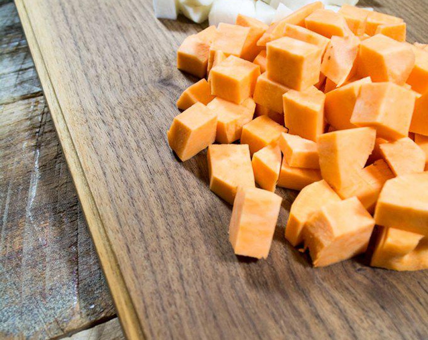 step 3 Add Sweet Potatoes (2) and chopped Carrots (4) and cook another 3-4 minutes.