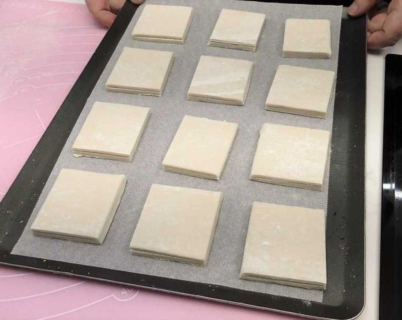 step 3 Cut the Puff Pastry (1 sheet) in squares of 5x5-cm and place in a baking tray lined with baking paper.