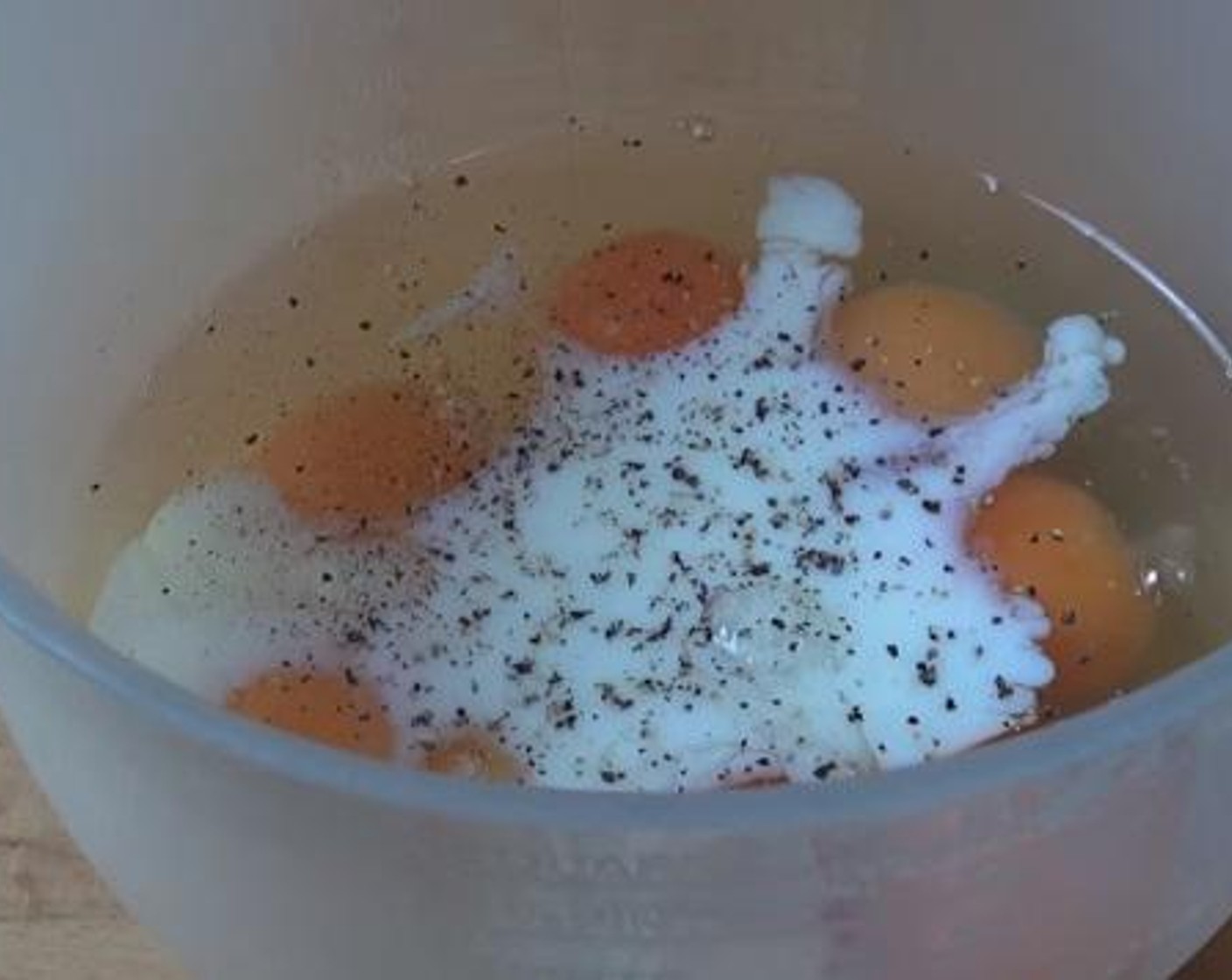 step 3 Into a bowl, add and mix the Eggs (8), Milk (1/3 cup), Salt (to taste) and Ground Black Pepper (to taste).