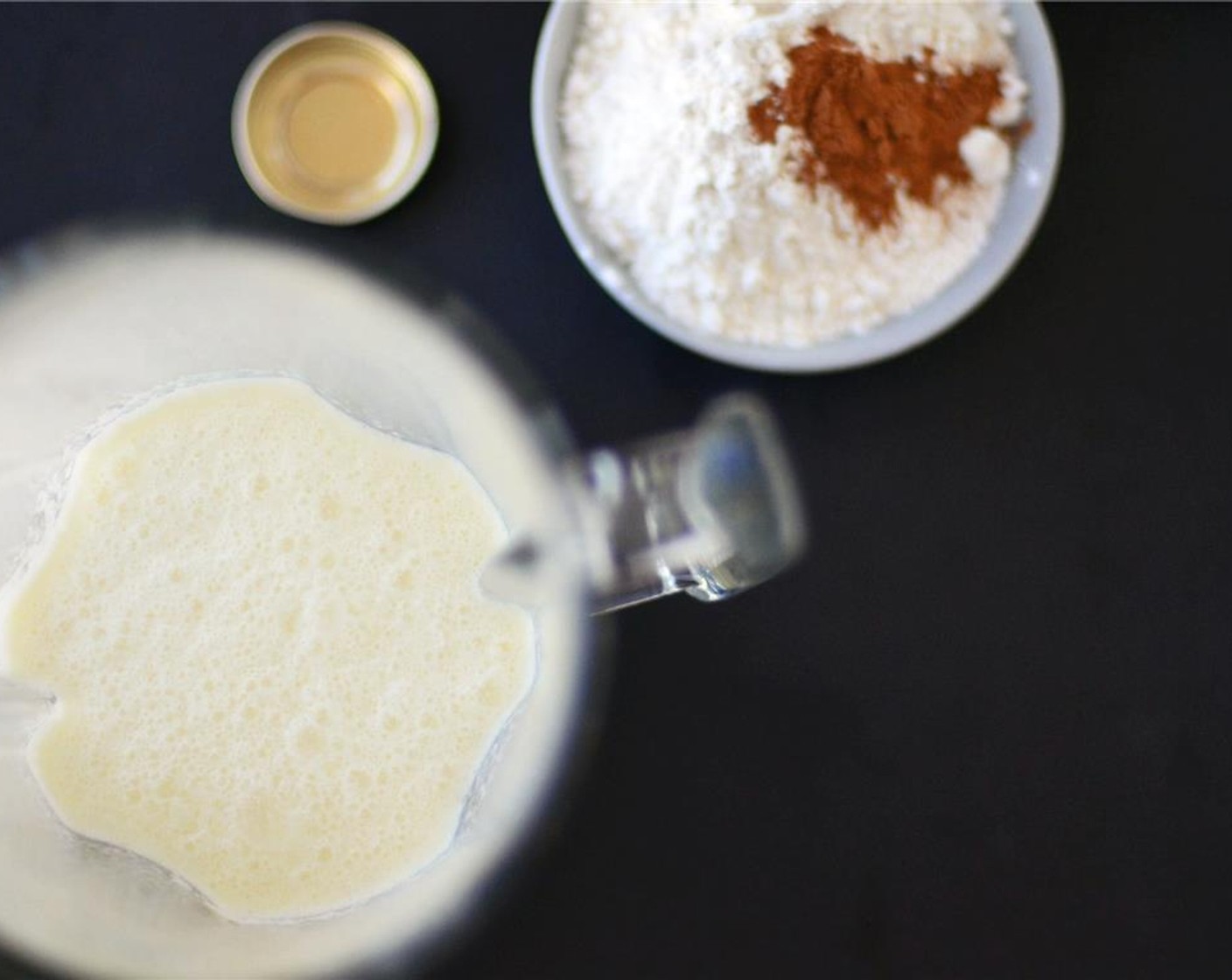 step 3 Add the All-Purpose Flour (1 cup), Salt (1 pinch), Ground Cinnamon (1/2 tsp), and Pure Vanilla Extract (1/2 tsp) to the blender. Blend until smooth and frothy.