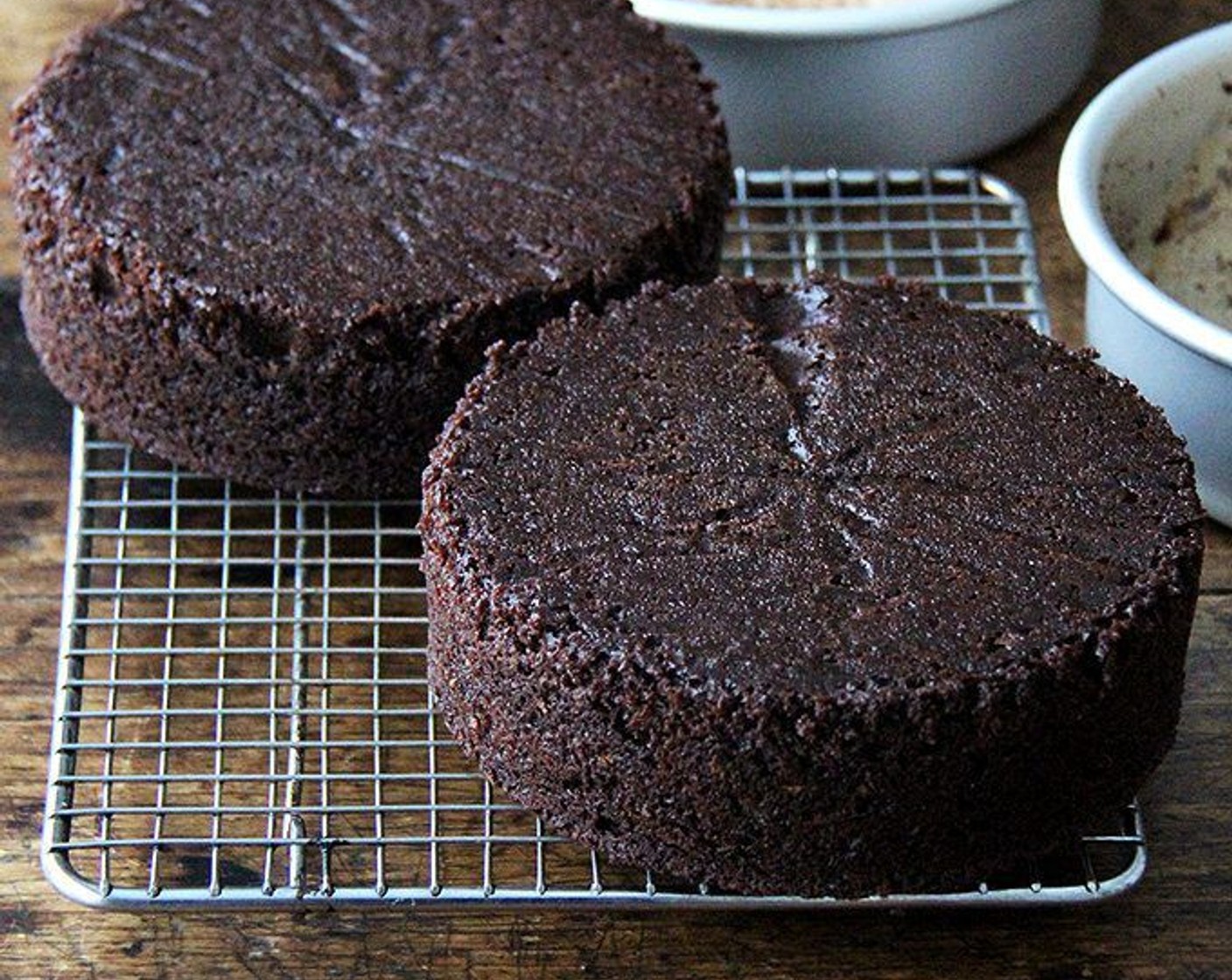 step 11 Run a thin knife around edges of pans and invert layers onto racks. Remove parchment paper and cool layers completely. Cake layers may be made 1 day ahead and kept, wrapped well in plastic wrap, at room temperature.