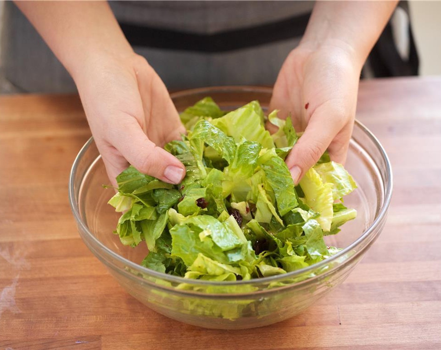 step 8 Add the vinaigrette to the large bowl with the romaine lettuce and mix well until incorporated. Set aside.