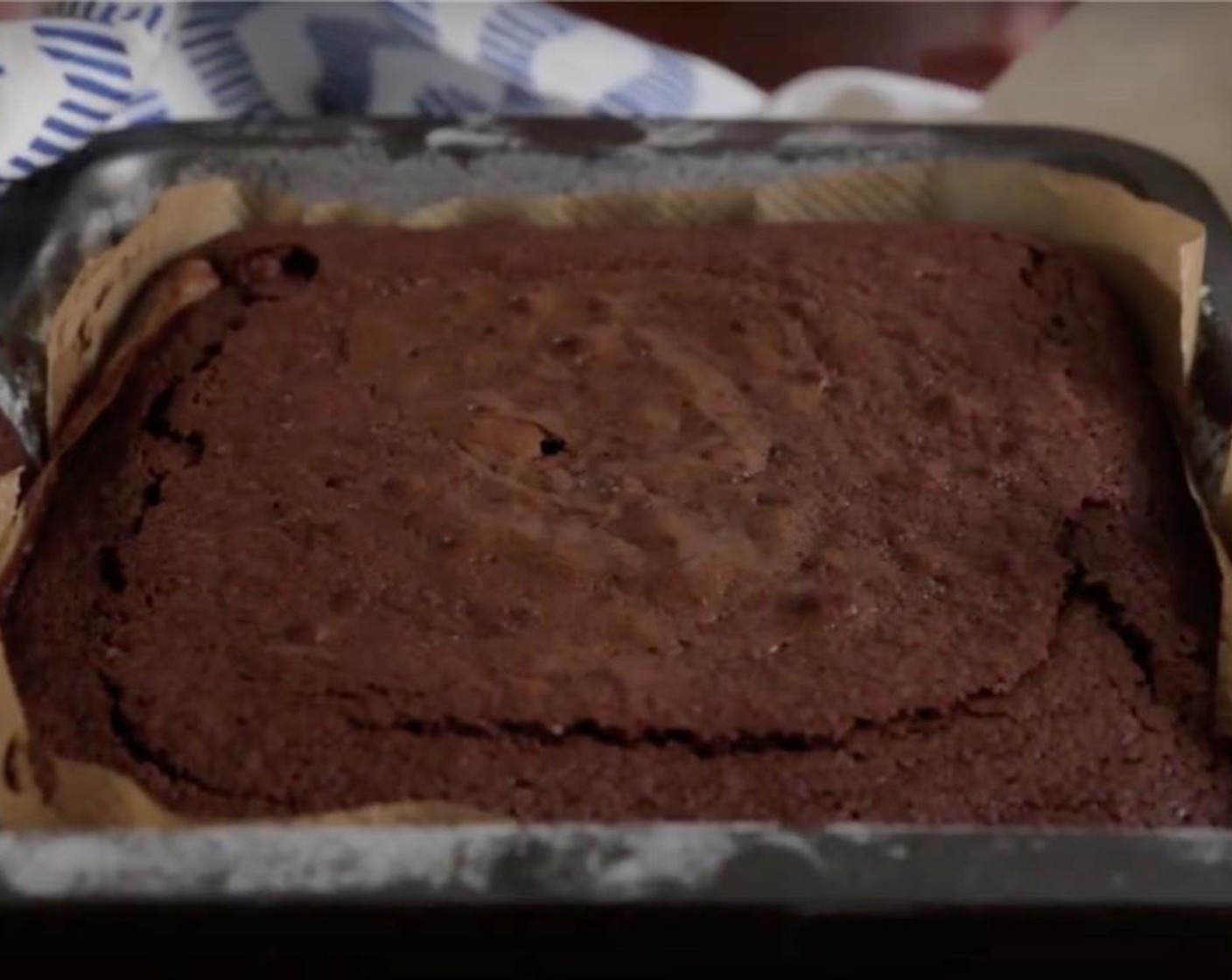 step 8 Bake for 35-38 minutes, or until a toothpick comes out with a few crumbs. Allow brownies to cool.