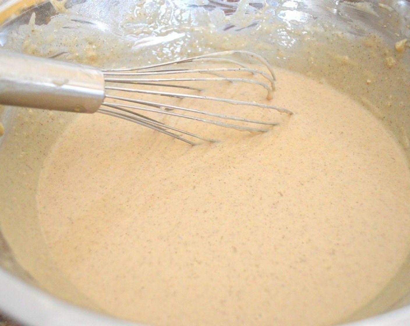 step 4 Whisk the Milk (2 cups), Butter (1/2 cup), Eggs (2), and Rose Water (1/2 tsp) together in another bowl. Pour the wet ingredients into the dry ingredients and whisk it all together thoroughly until smooth.