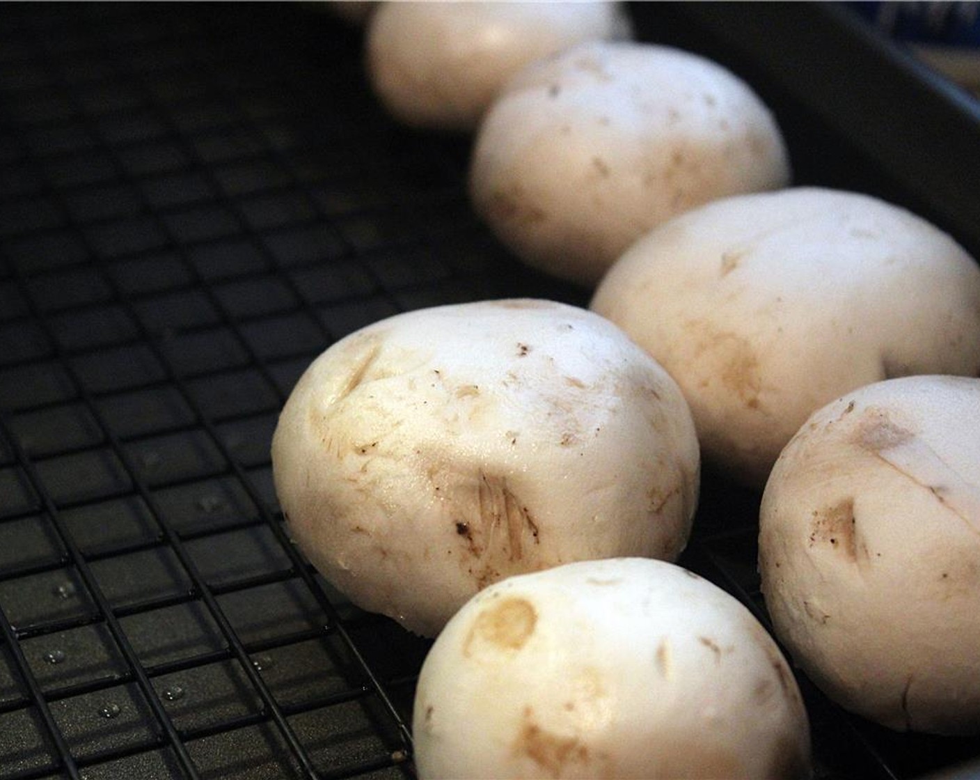 step 10 Bake the portobello mushrooms, with the tops up on baking sheet with a rack on it for about 15 minutes. They should be beginning to slump but aren’t fully cooked.