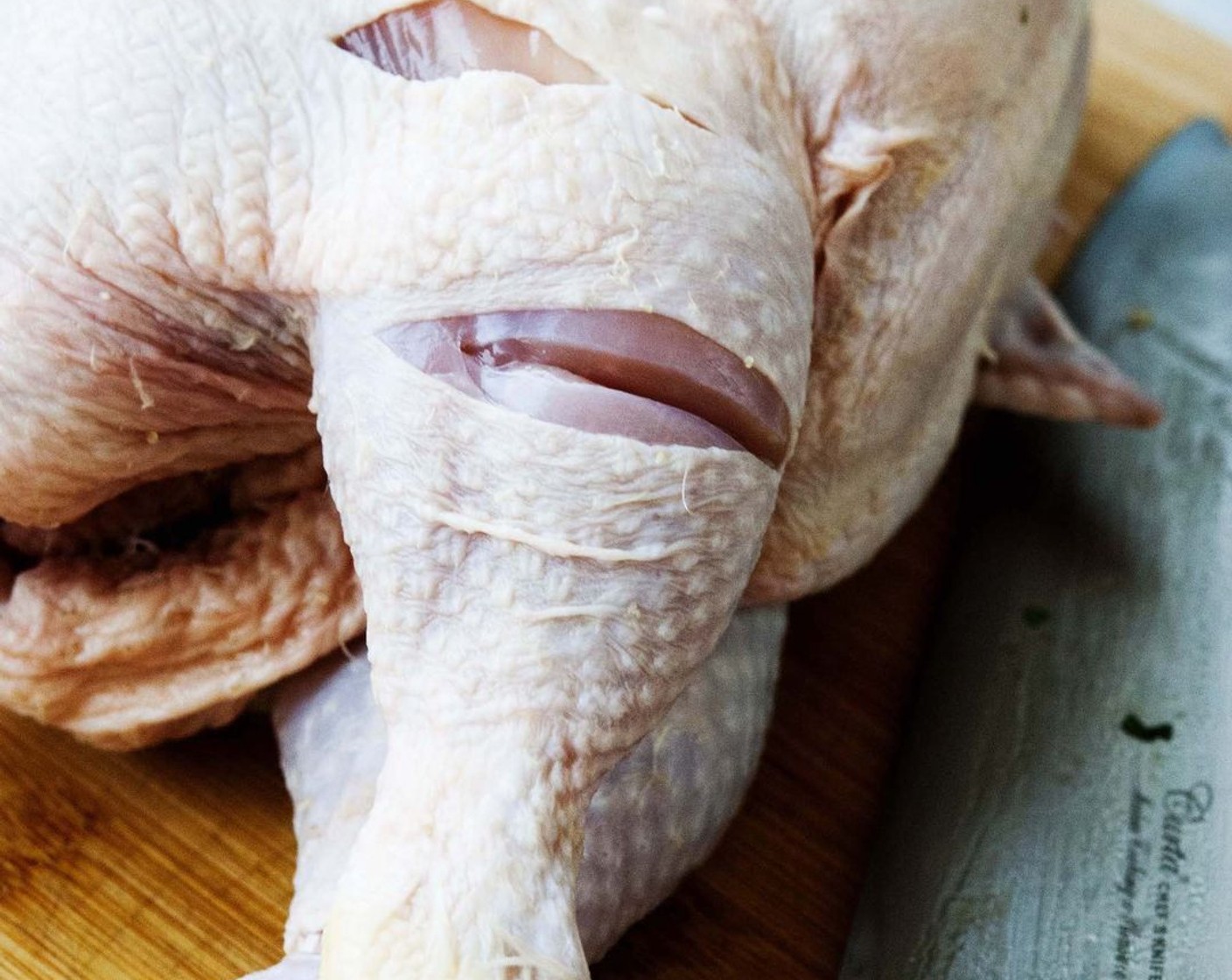 step 4 With a sharp knife make some cut on the tights to ensure that the breast and tights will cook evenly and at the same speed.