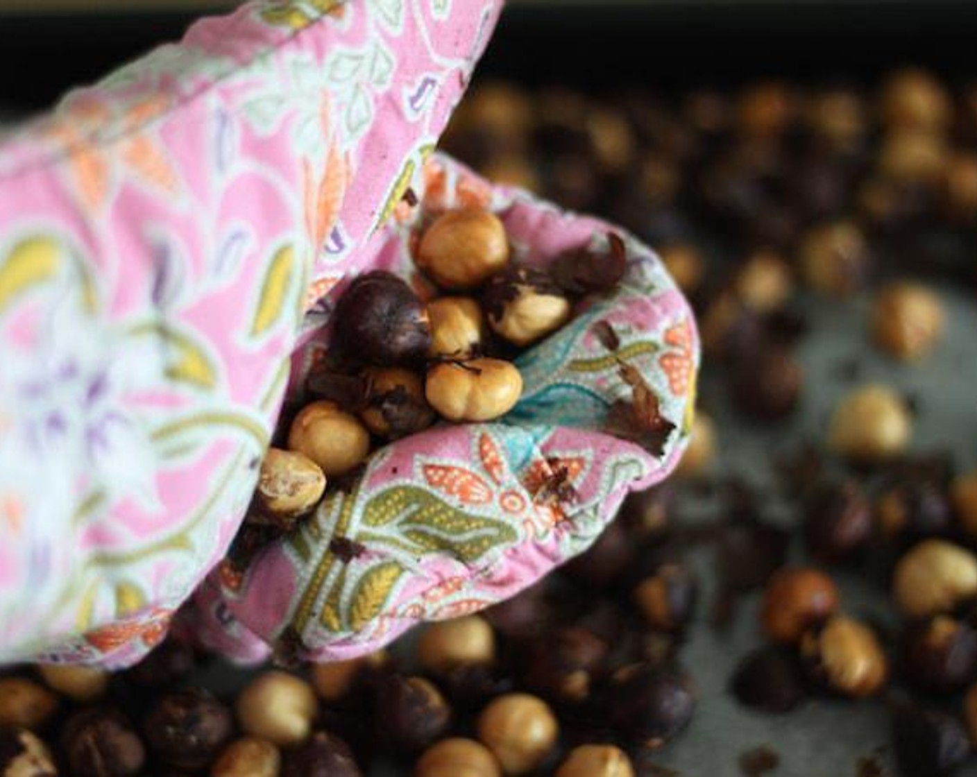 step 4 After roasting the hazelnuts, allow the nuts to cool. Then rub them in a dishtowel to help remove their skins. It doesn't matter if you get every last speck of skin off. You just want to remove as much as humanly possible.