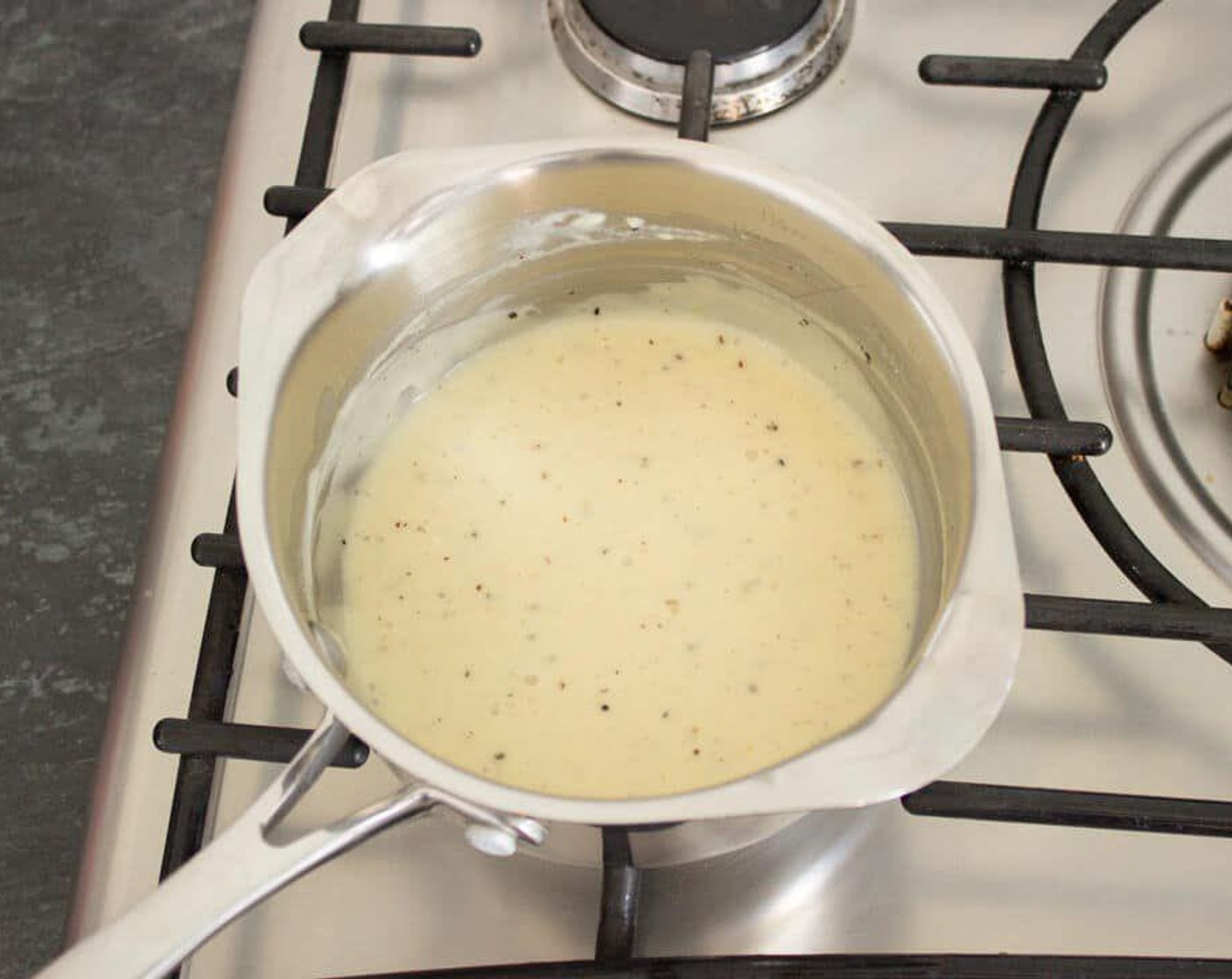 step 5 Add in a little Simply Organic Nutmeg, Ground (to taste) and season well with Salt (to taste) and Simply Organic® Black Pepper (to taste). Then stir through Parmesan Cheese (1 Tbsp). If the sauce is still a little runny, turn the heat up to medium and cook, stirring constantly, until it thickens.