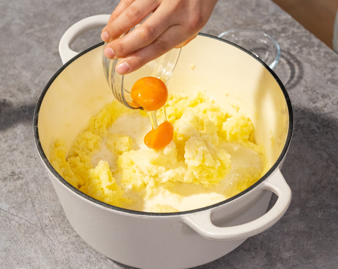 step 9 Add Milk (1/2 cup) and Eggs (2) yolk. Mix together and season with Salt (1 tsp) and Ground Black Pepper (1 tsp).