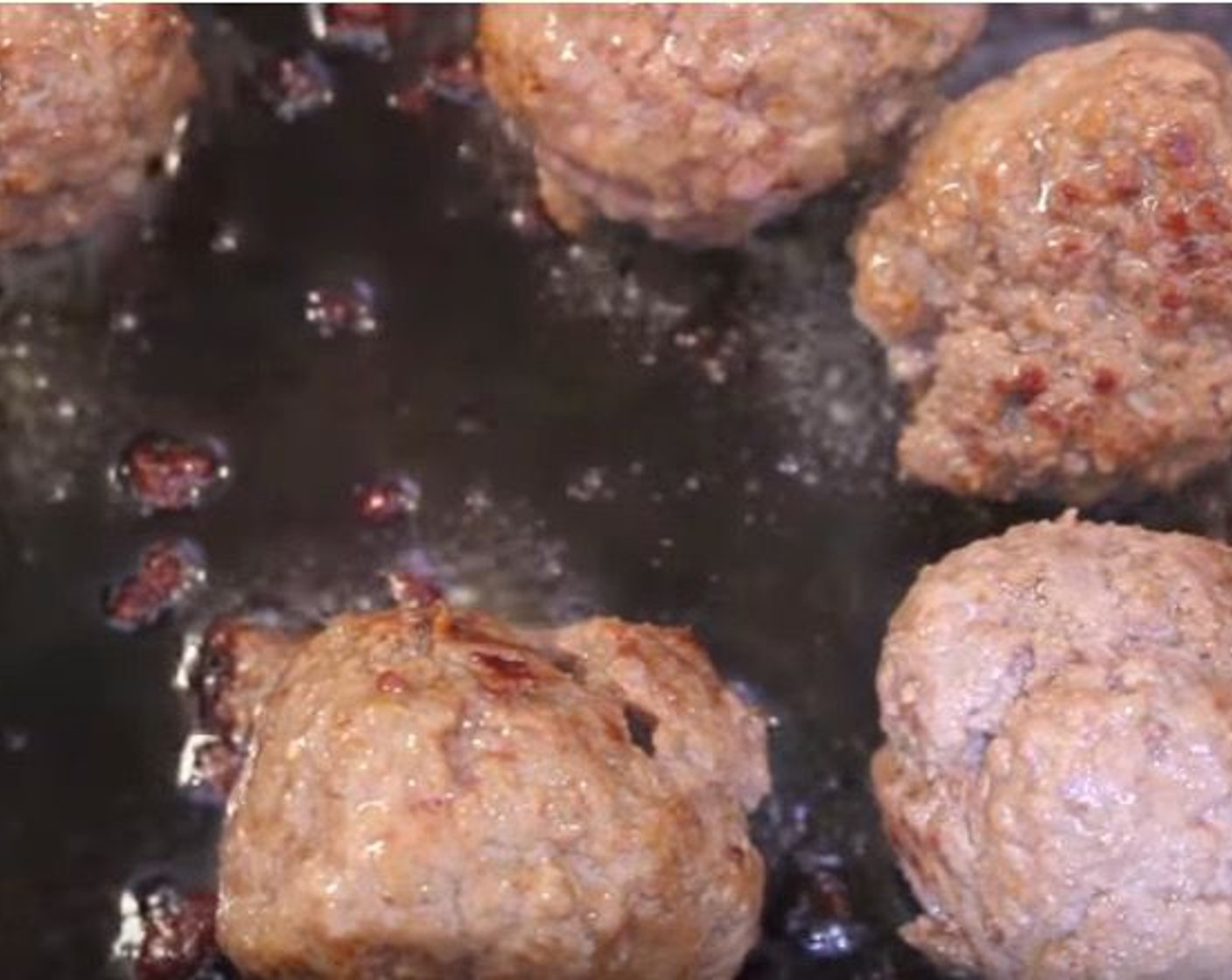 step 15 In a pan over medium-high heat, sear the meatballs on all side for 3 minutes.