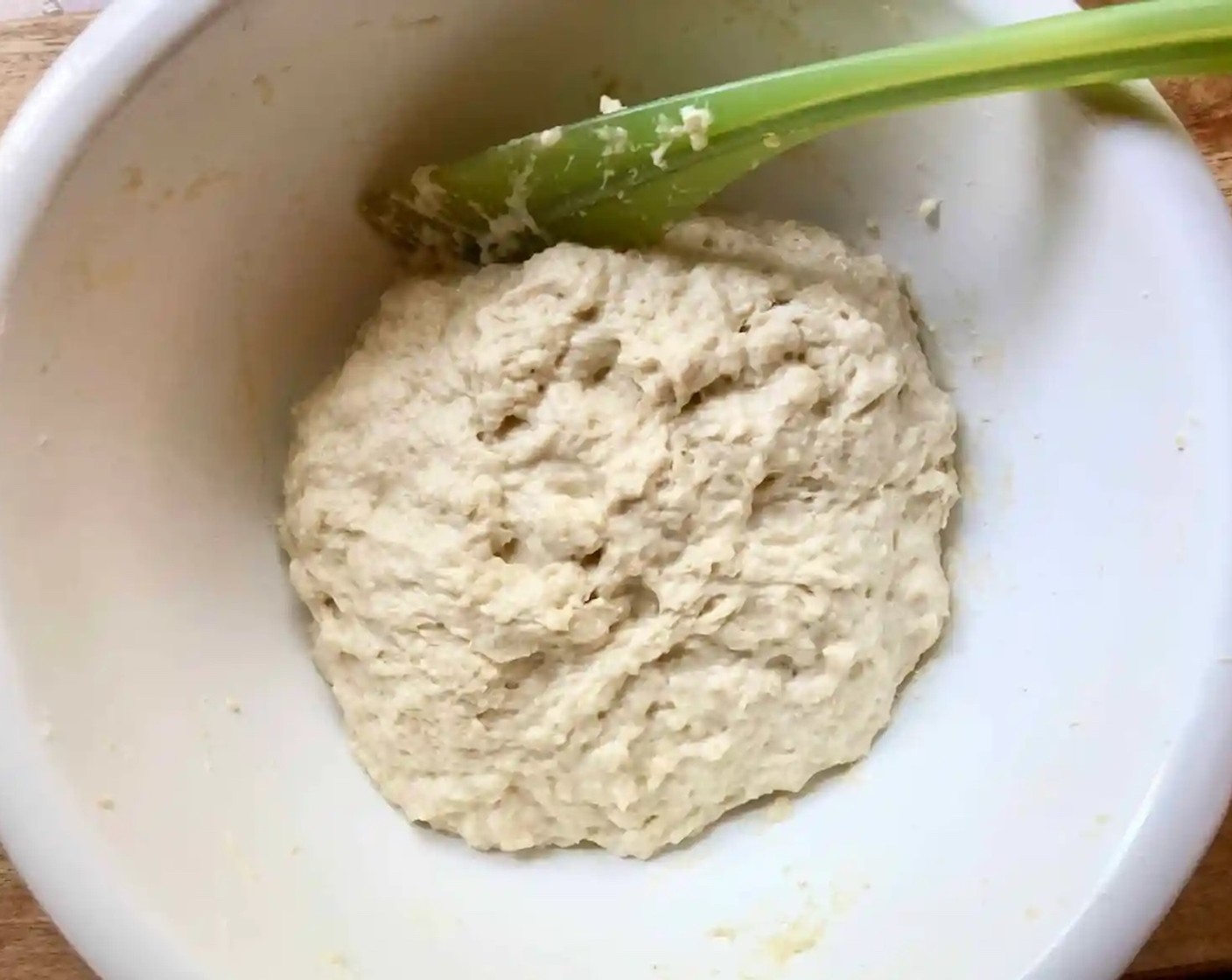 step 3 Heat the Milk (1/3 cup) and Butter (4 Tbsp) together until the butter is melted. Pour this hot mixture into the cold water-egg mixture. The combined mixture should be perfectly lukewarm. Add it to the flour bowl and stir with a spatula till you have a sticky dough ball.