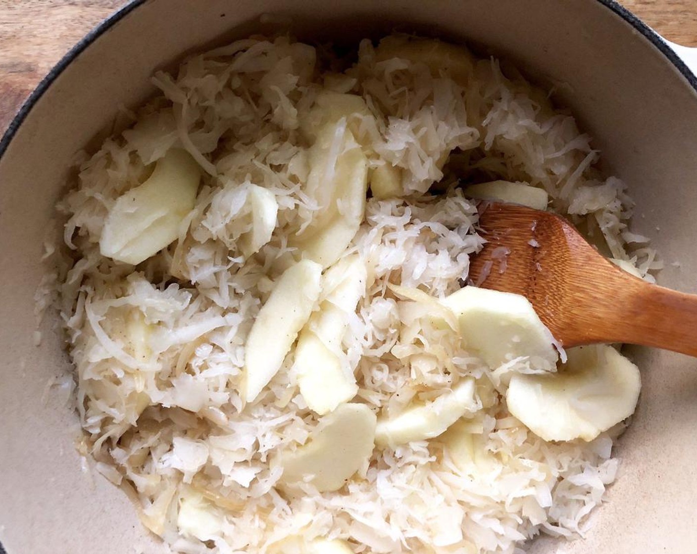 step 3 Stir in the Sauerkraut (12 cups), Fuji Apples (2), and Dry White Wine (1 cup).  Bring to a boil. Reduce heat; simmer, covered, for about 1 hour or until sauerkraut is very tender, stirring occasionally.