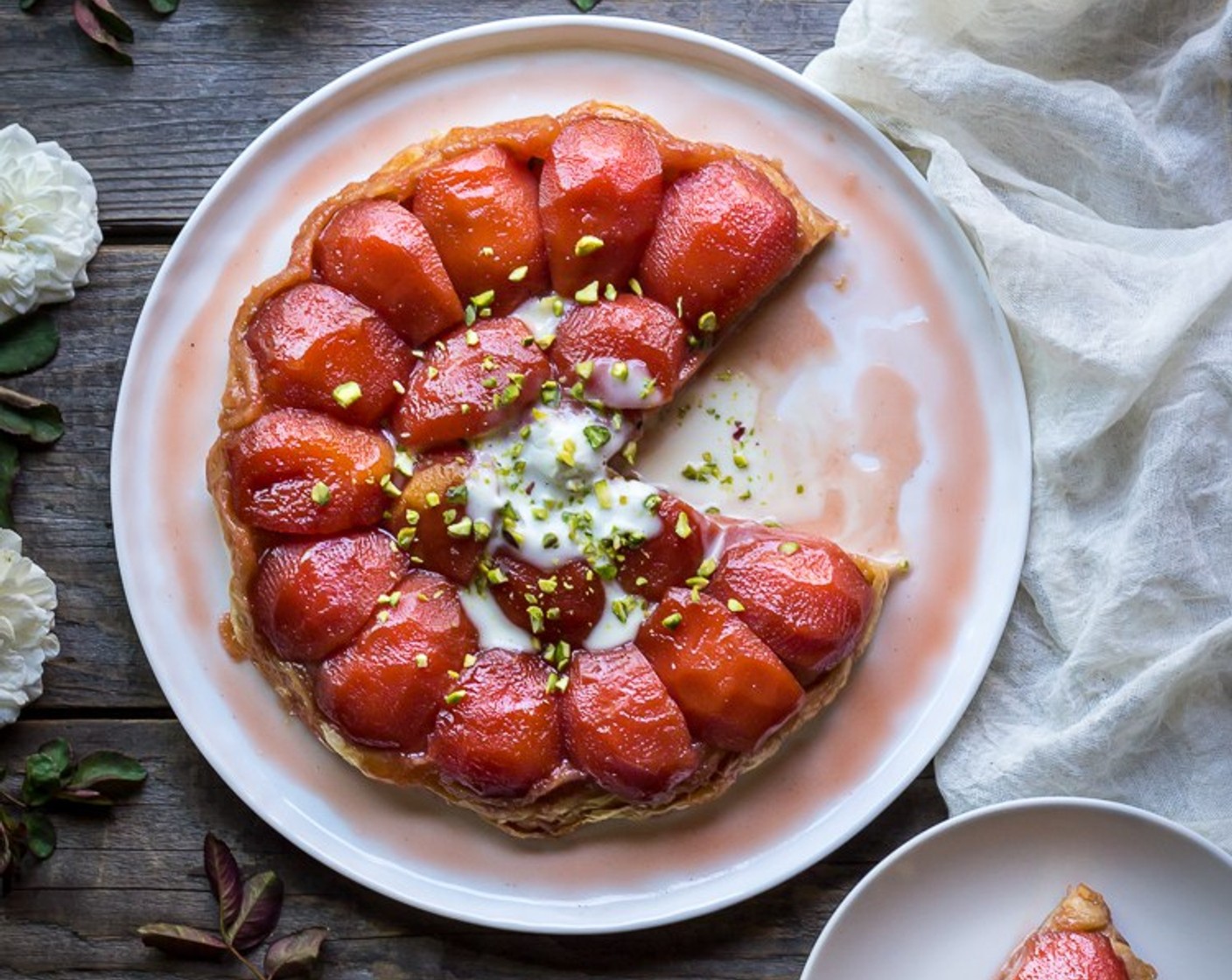 step 15 Serve the tart warm with the cardamom creme fraiche and crushed pistachios.