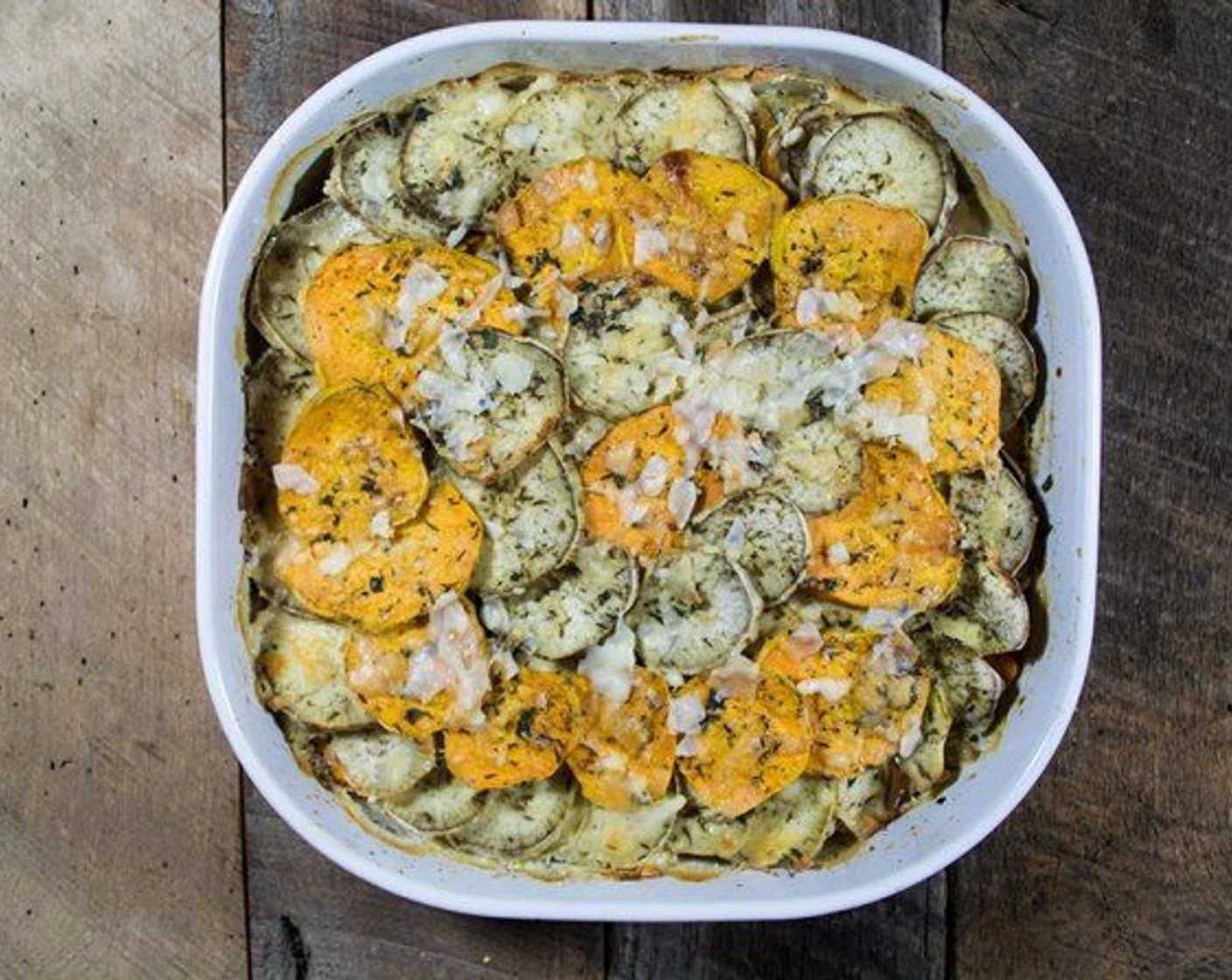 step 9 Sprinkle the remaining Parmesan over the top of the potatoes and bake for an additional 15 minutes, or until potatoes are cooked.