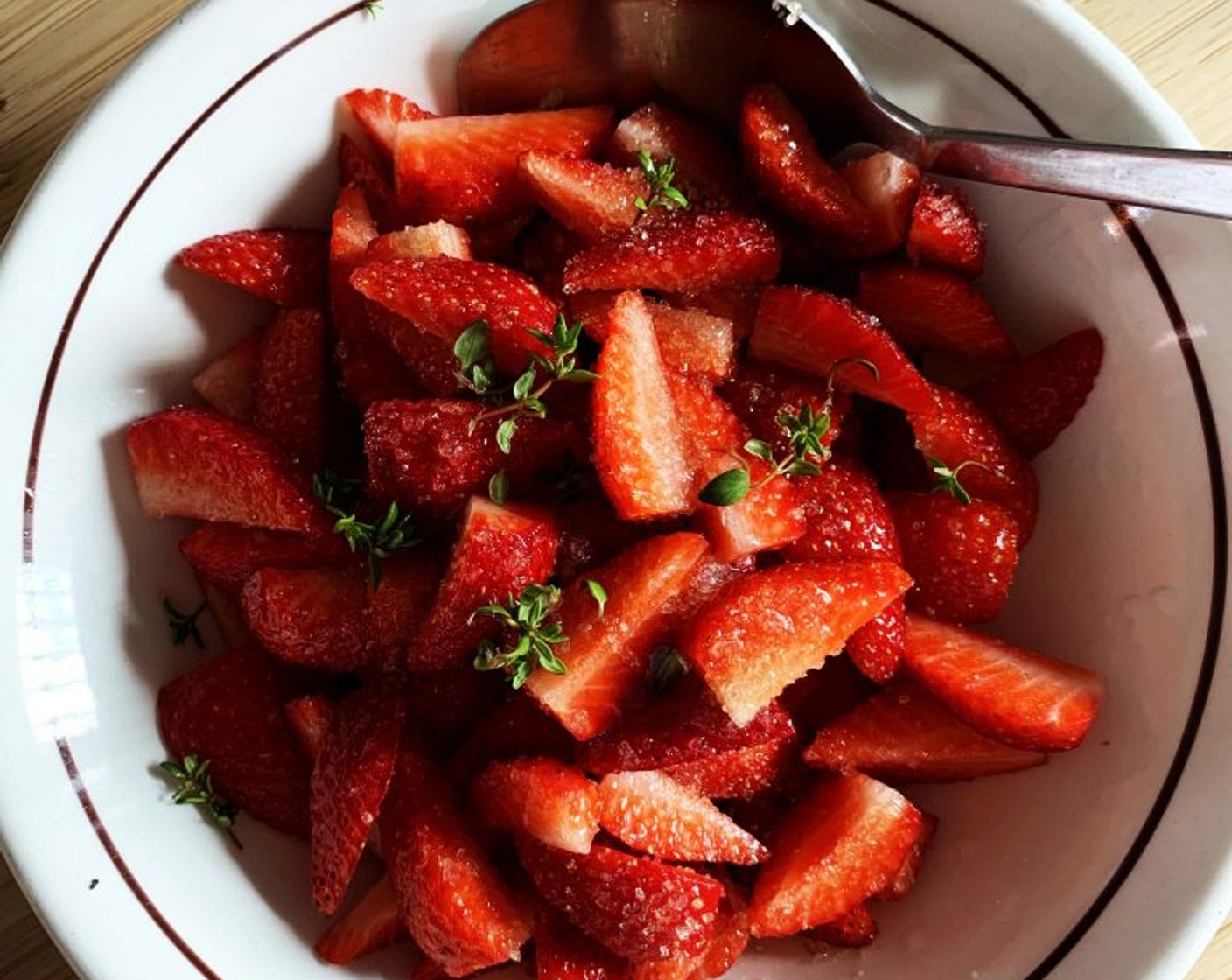 step 4 The following day, wash and slice your Fresh Strawberries (2 cups), mix them with the juice of half a Lemon (1/2), Cane Sugar (1 Tbsp), and some Fresh Thyme Leaves (to taste), Set aside.
