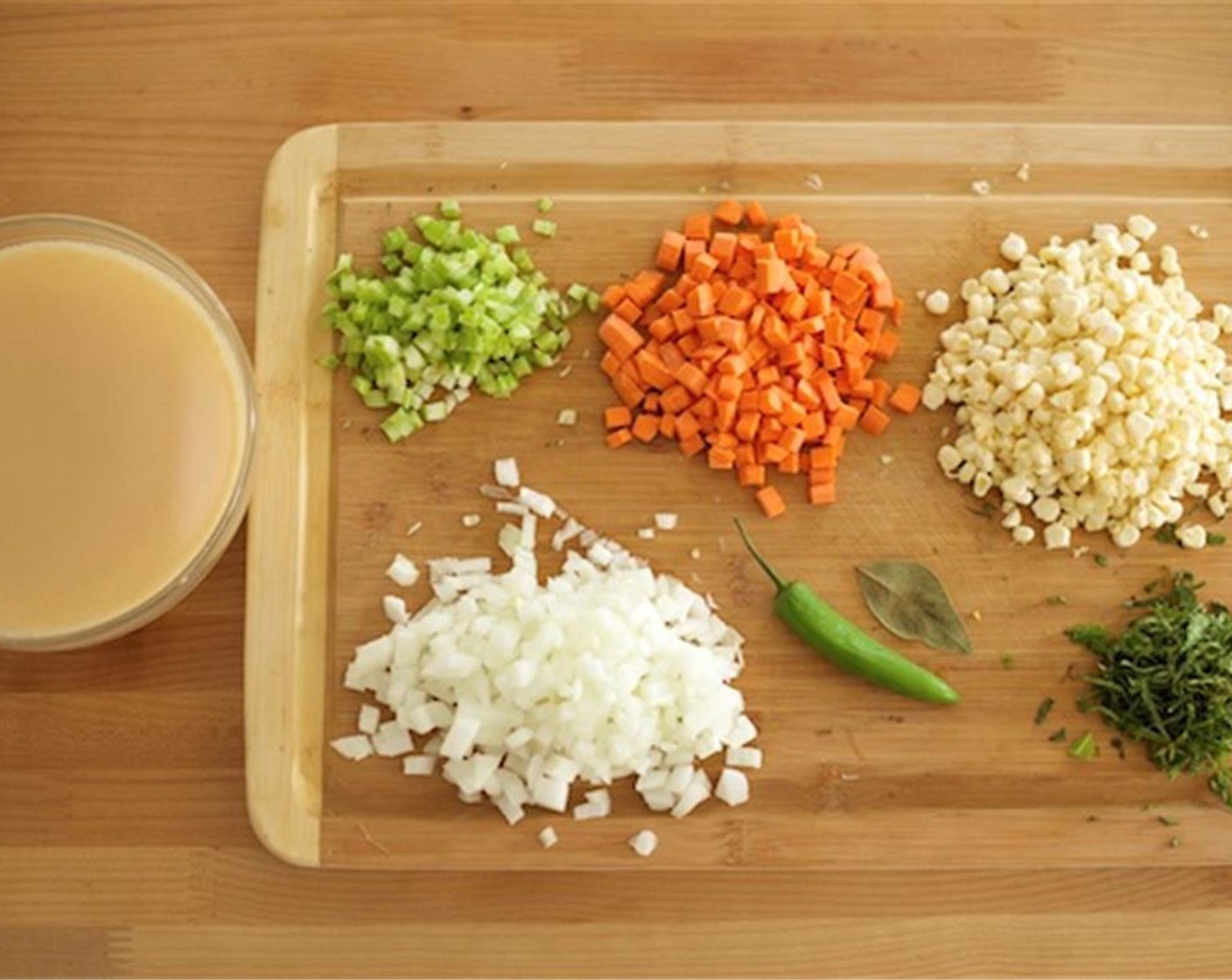 step 2 Peel and cut the Onion (1) into quarter inch pieces and set aside. Peel Carrots (2). Dice the Celery (1 stalk) and carrot into a quarter inch dice, and set aside together on a plate.