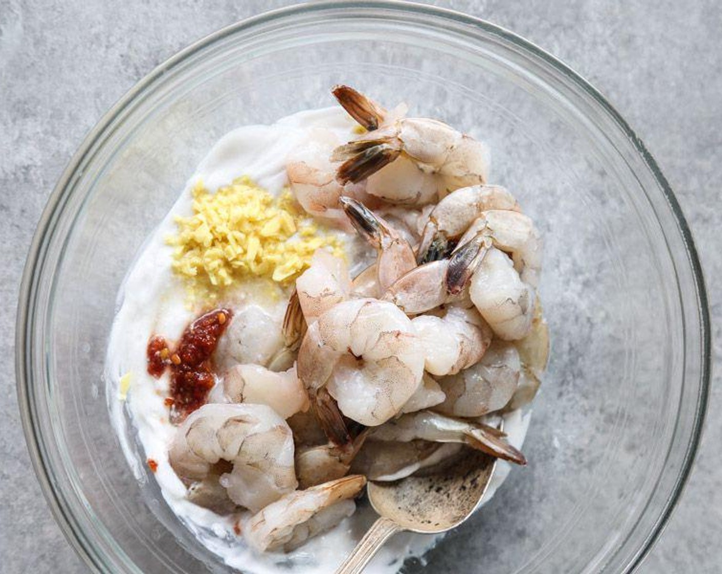 step 2 In a large mixing bowl, toss the Shrimp (1 lb), Fresh Ginger (2 Tbsp), Coconut Cream (1 cup), juice from Limes (2), Sambal (1 tsp), and 1/2 teaspoon Sea Salt (to taste) until combined.