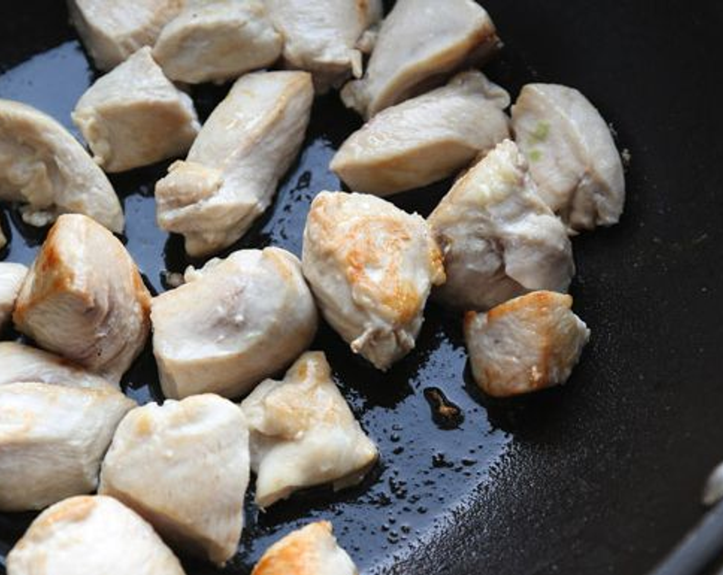 step 1 In a large nonstick skillet, melt the Coconut Oil (2 Tbsp) over medium heat. Add the Chicken Breast (1 lb) in an even layer and cook until golden brown on the first side, about 3 minutes. Flip the chicken and cook for another minute. Remove from the pan and set aside.