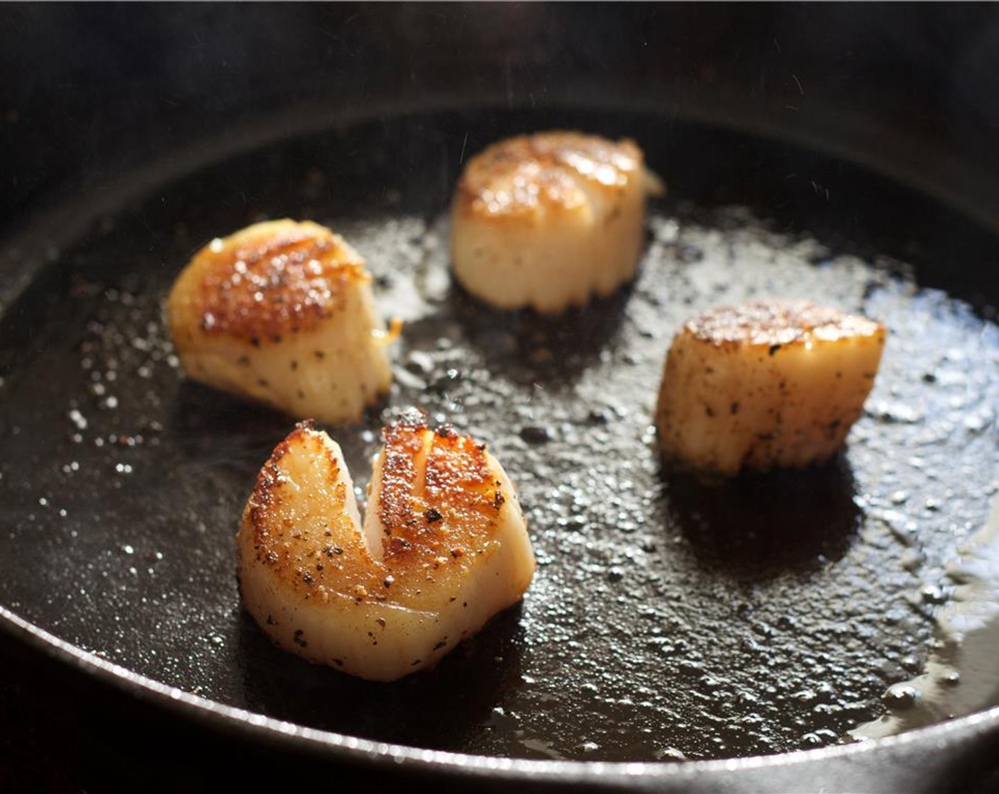 step 7 Add the scallops to the pan. When the Grapeseed Oil (2 Tbsp) is shimmering hot, place the scallops in the skillet and cook without moving for one and half to two minutes. When golden brown, flip and cook for an additional minute. Remove from skillet.