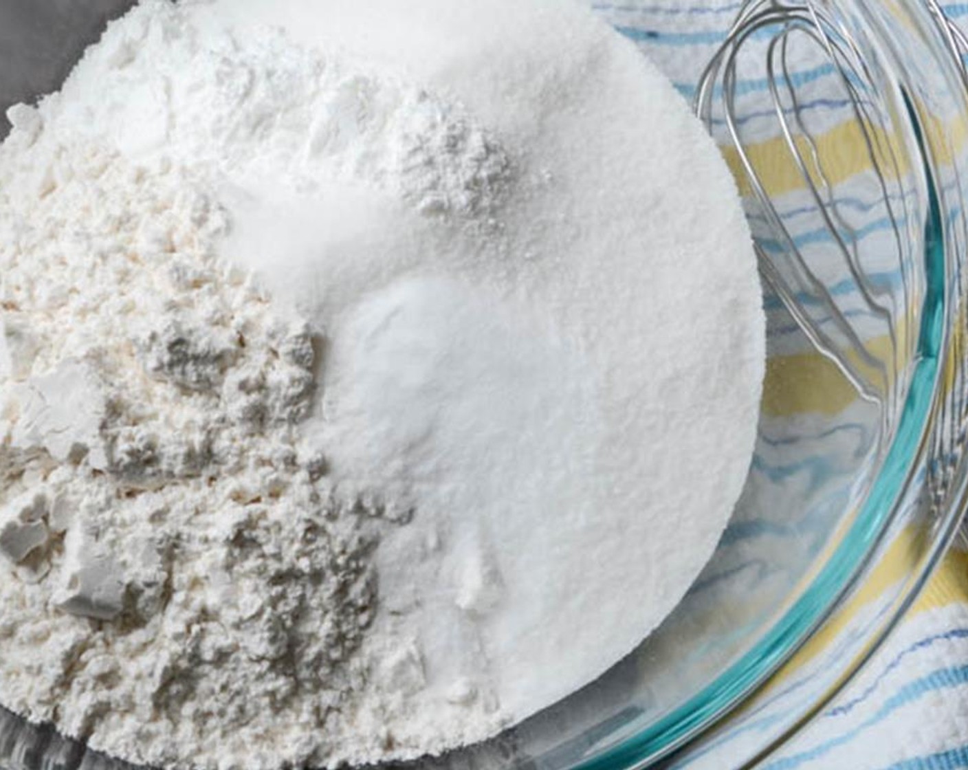 step 2 Add sifted All-Purpose Flour (3 cups), Granulated Sugar (1 cup), Baking Powder (1 Tbsp)  Baking Powder (1 tsp), and Salt (1 tsp) to a large bowl and whisk together. Set aside.