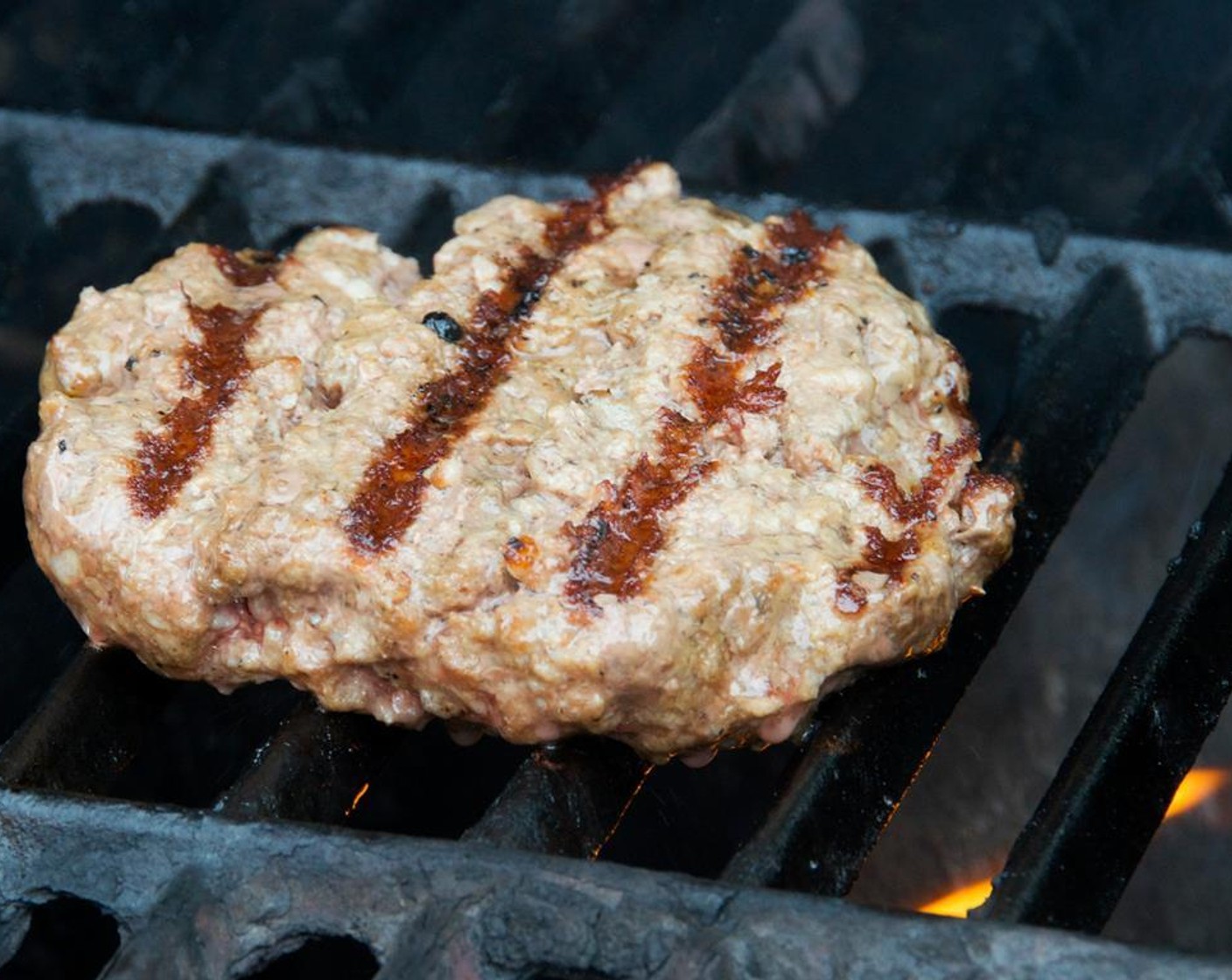 step 9 Place the burgers on the grill and cook 3 to 4 minutes on each side for medium-rare to medium. During the last minute of cooking, sprinkle on about 1/4 cup of cheese for each burger.